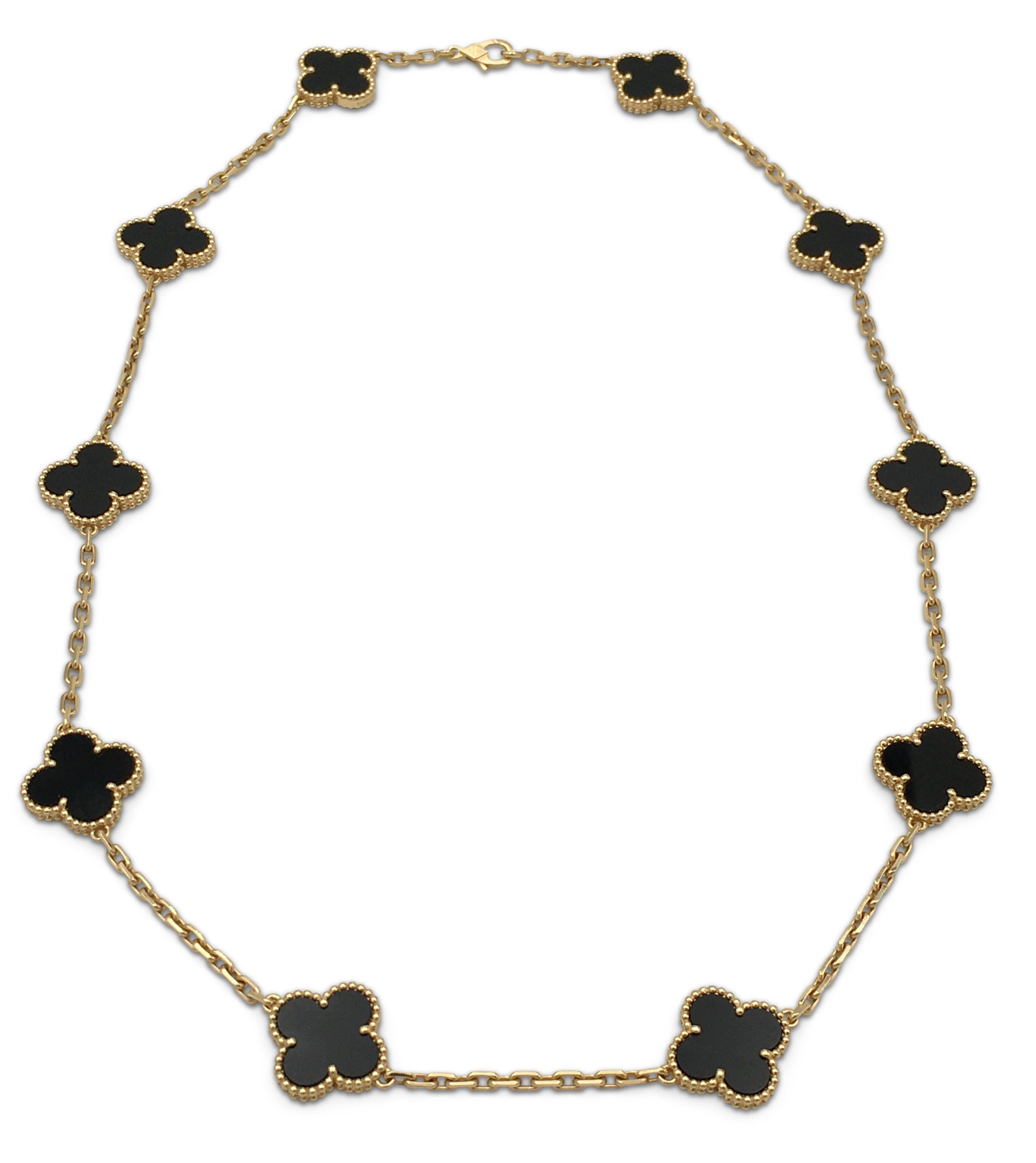 Authentic Van Cleef & Arpels 'Vintage Alhambra' necklace crafted in 18 karat yellow gold featuring 10 clover leaf inspired motifs of carved onyx. Signed VCA, Au750, with serial number and hallmarks. Necklace is not presented with original box or