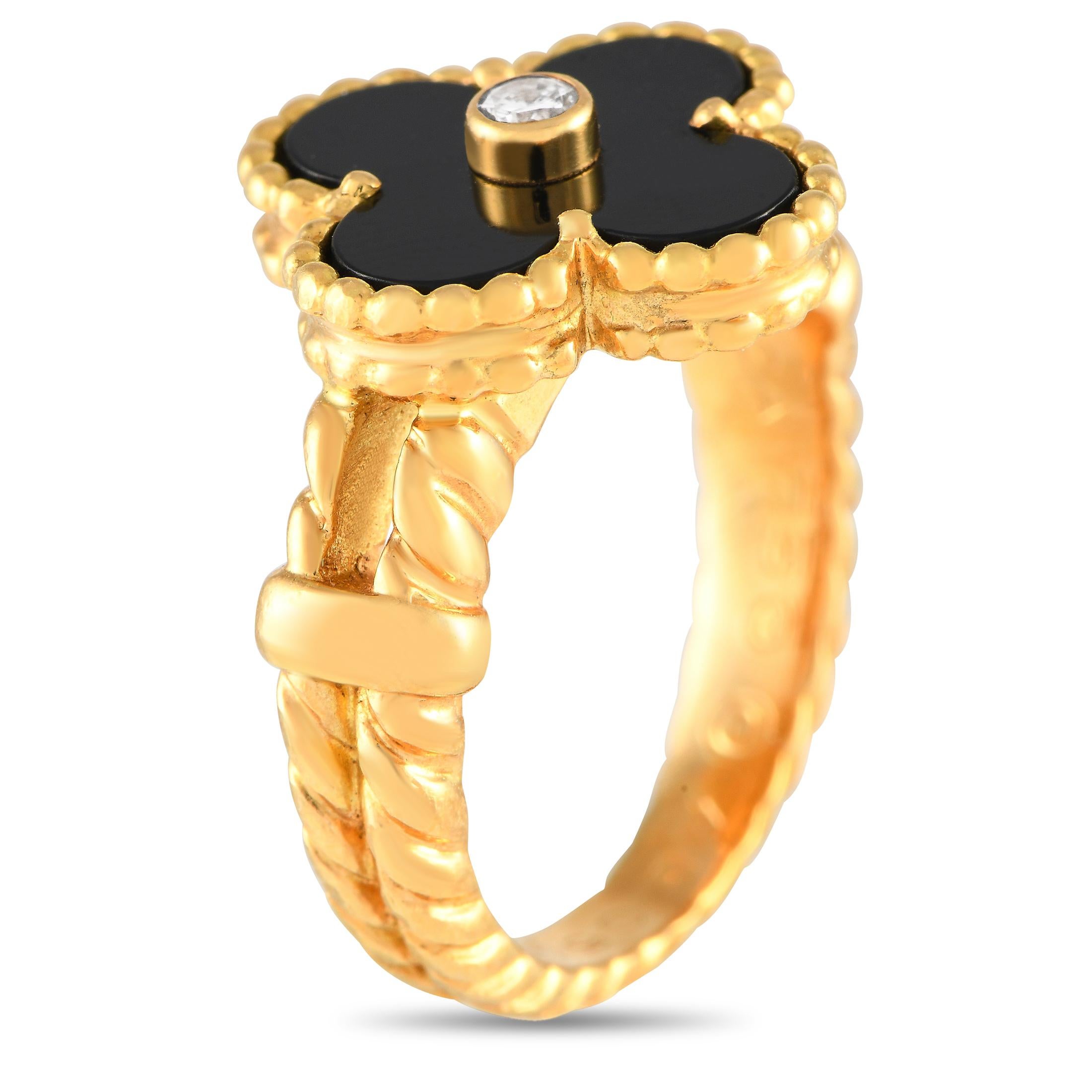 A must-have in a jewelry capsule wardrobe. This vintage Van Cleef & Arpels Alhambra ring features an elaborate rope-twist band crafted in 18K yellow gold. It bears a quatrefoil motif with a black onyx inlay and a bezel set diamond at the center. The