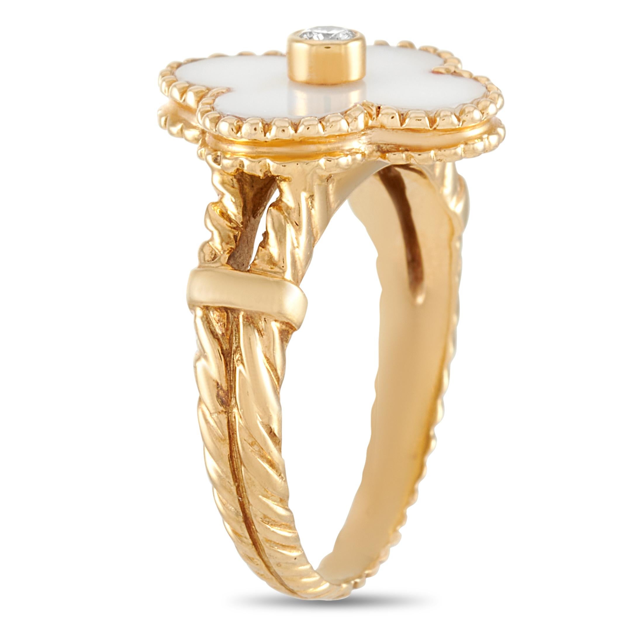 The Van Cleef & Arpels “Vintage Alhambra” ring is made of 18K yellow gold and embellished with white coral and a diamond stone. The ring weighs 4.8 grams and boasts band thickness of 3 mm and top height of 5 mm, while top dimensions measure 10 by 17