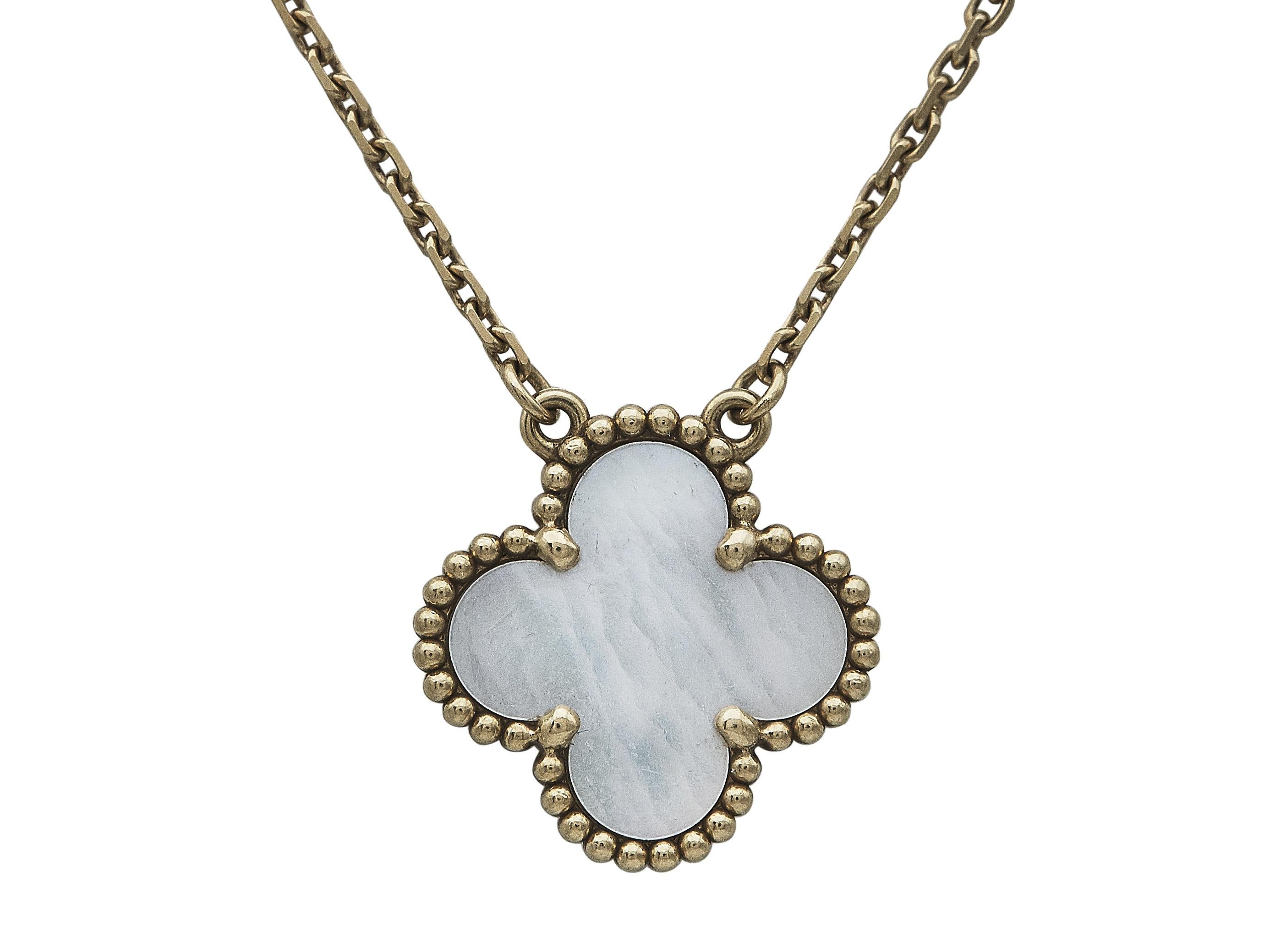 The bracelet: A Van Cleef & Arpels Vintage Alhambra pendant necklace. Designed as a single mother-of-pearl motif in yellow gold, suspending from a delicate chain. The single motif pendant necklace wears beautifully on its own or layered with other