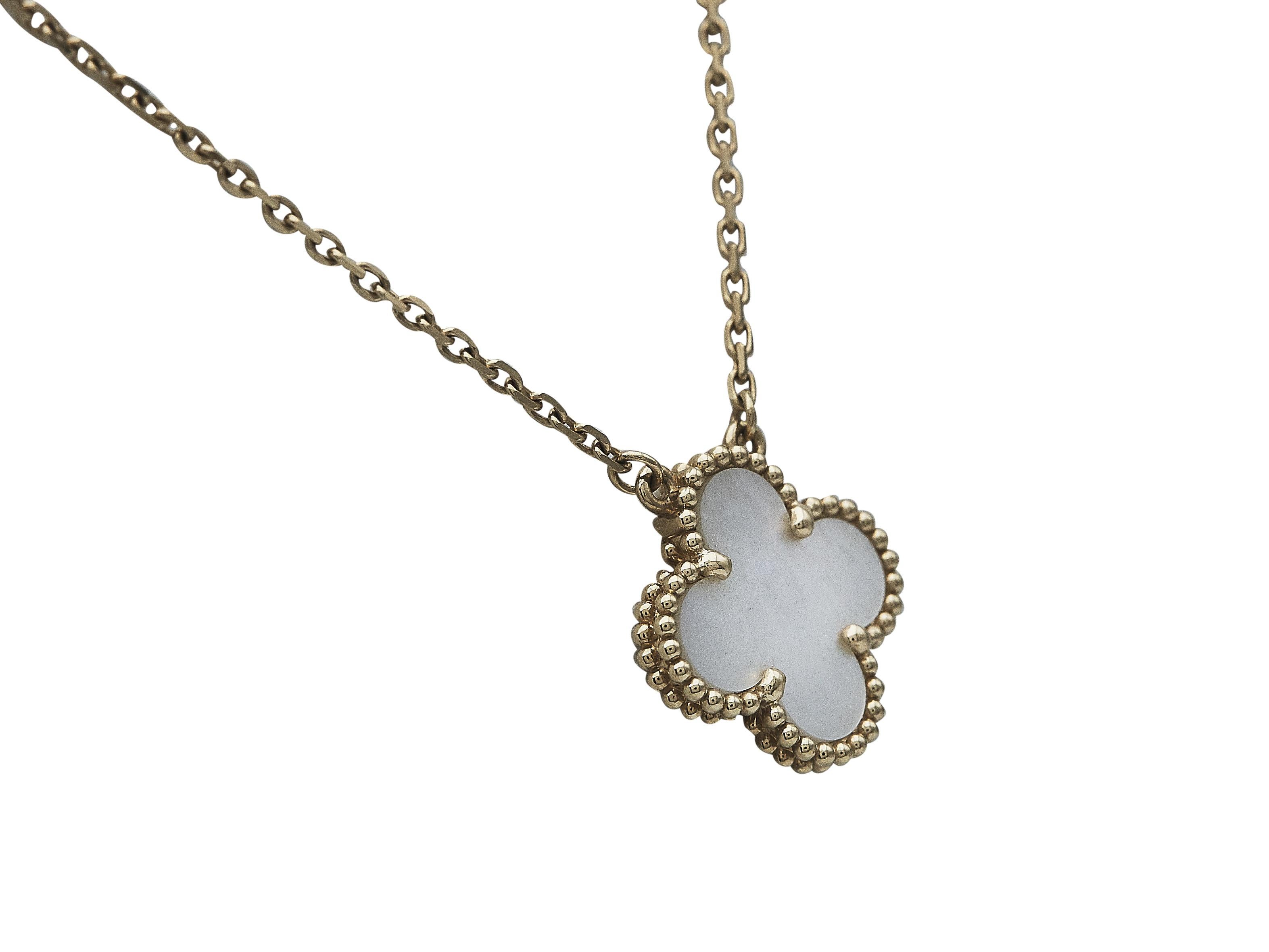 The necklace:
A Van Cleef & Arpels Vintage Alhambra eighteen karat yellow gold necklace. The delicate chain suspends a single mother-of-pearl motif.

The necklace is accompanied by...

Its Van Cleef & Arpels box

Its certificate of authenticity,