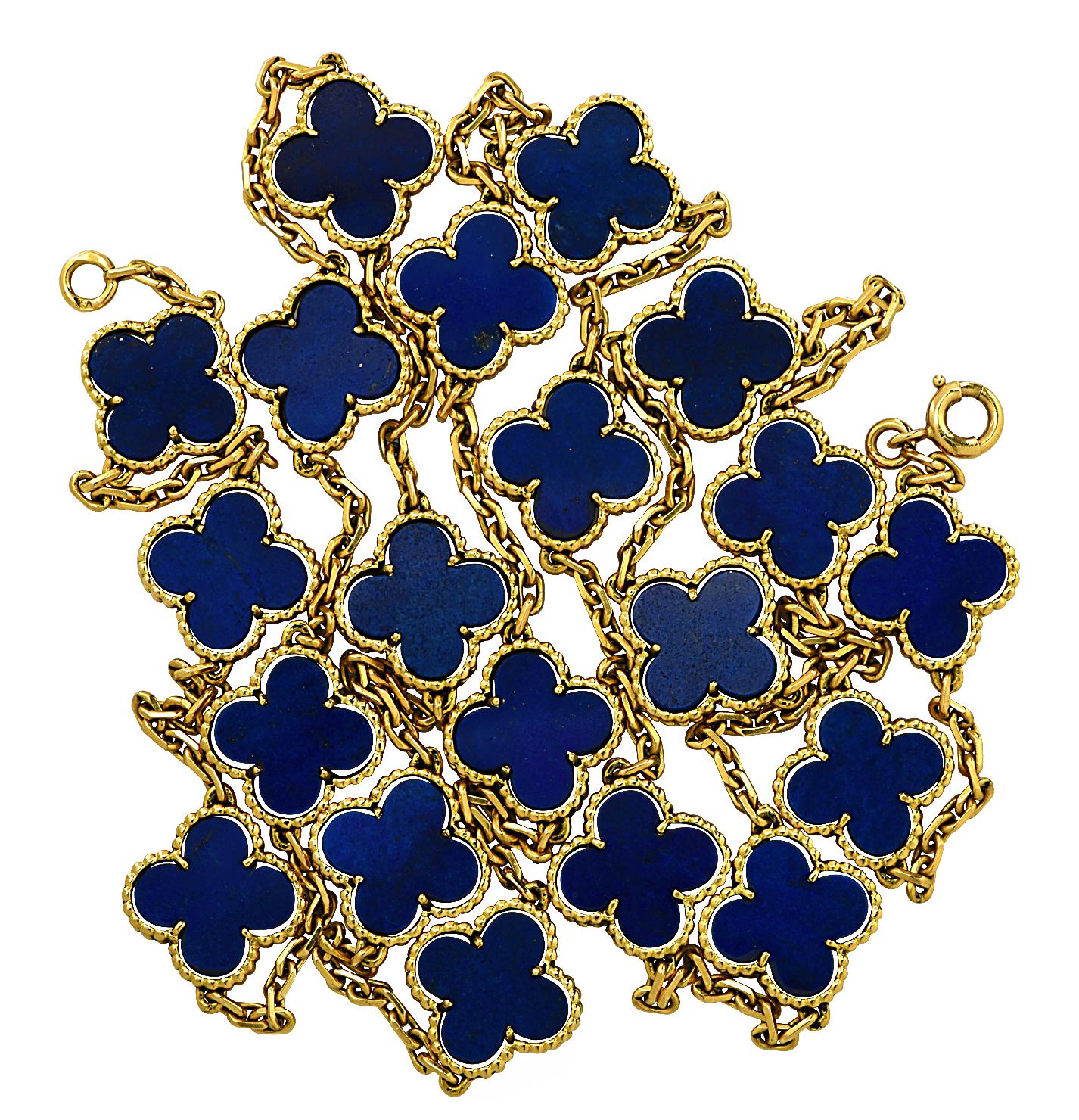 From the House of Van Cleef & Arpels, this exquisite Vintage Alhambra long necklace, 20 motifs, finely handmade in 18 Karat yellow gold, features an asymmetrical design inspired by the clover leaf. Twenty clover motifs embellished with blue lapis,