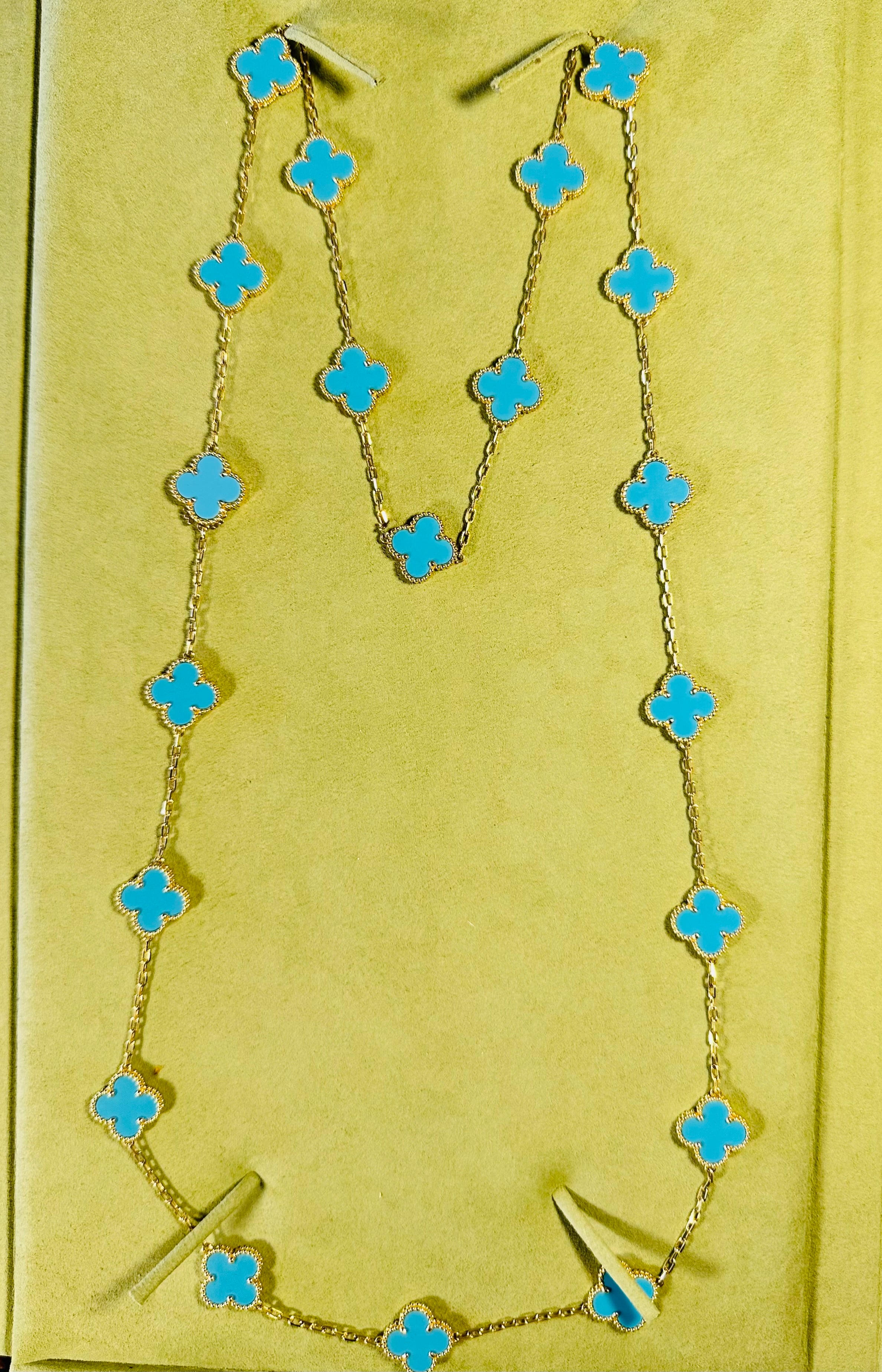 This classic vintage Van Cleef & Arpels necklace is crafted in 18k yellow gold and features 20 lucky clover motifs inlaid with turquoise in round bead settings. Made in France. 
Comes with original case serial number and papers
Clasp in 18K yellow