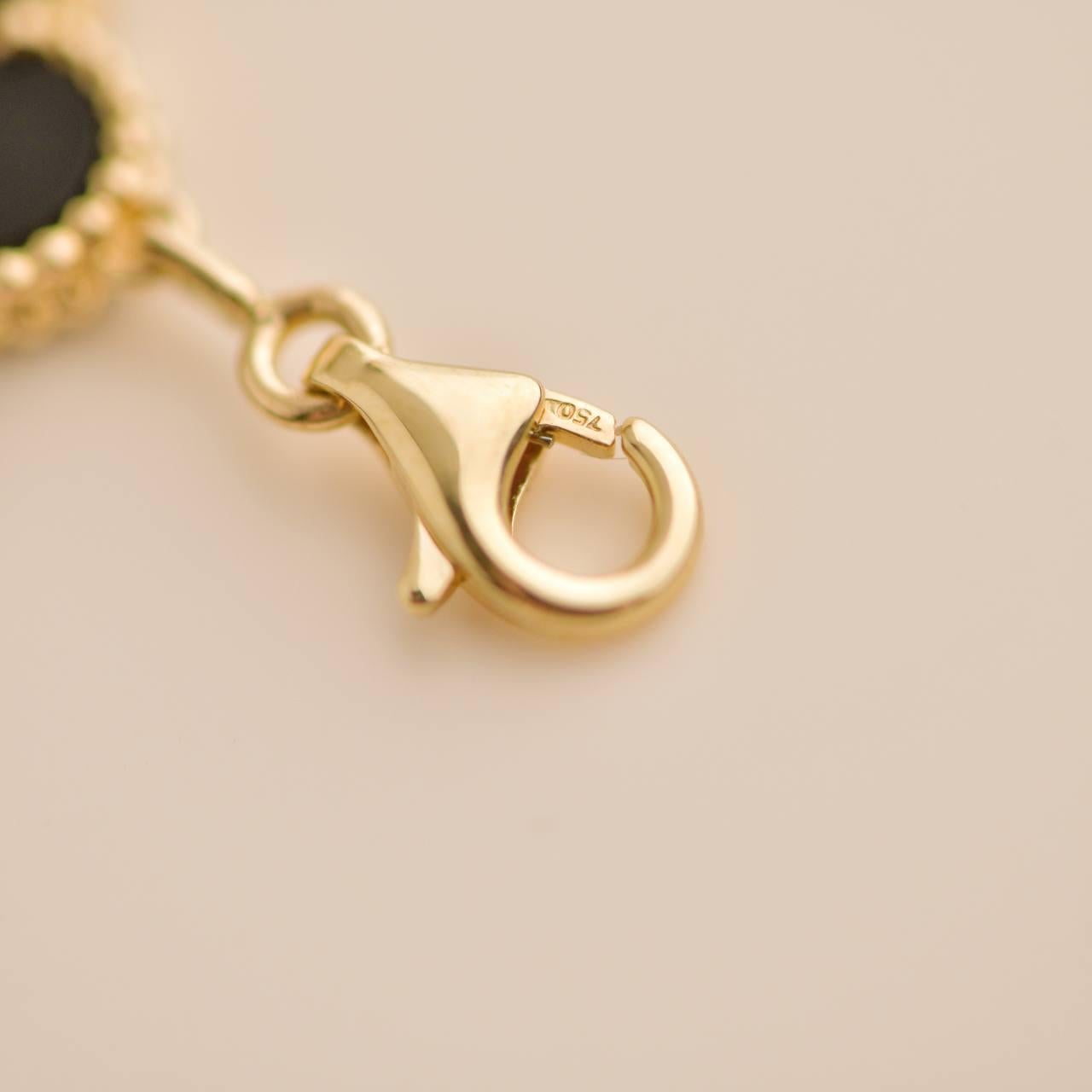 Van Cleef & Arpels Vintage Alhambra Armband aus 18 Karat Gelbgold mit 5 Motiven aus Onyx Damen
