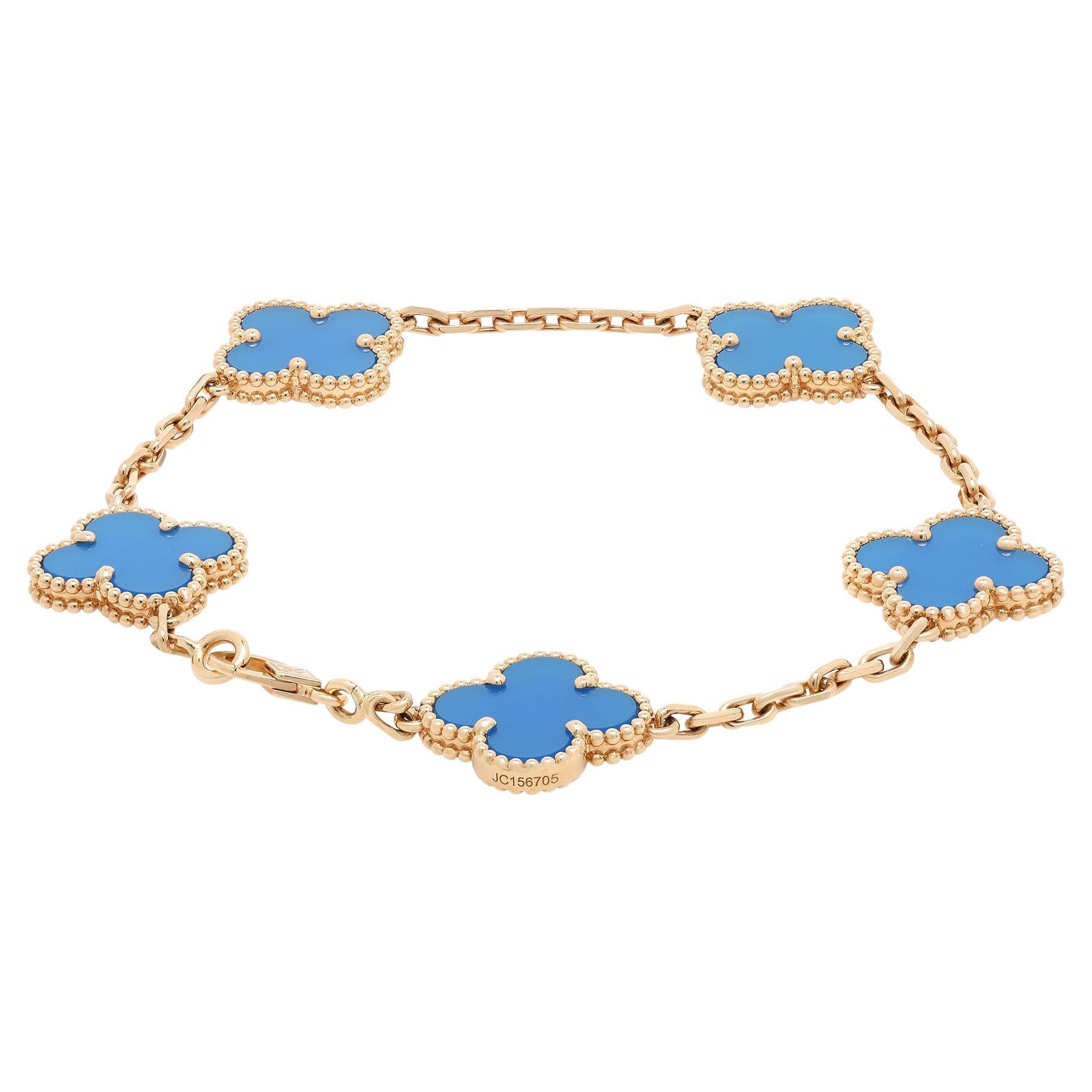 This stunning Van Cleef & Arpels Vintage Alhambra bracelet features 5 blue Agate stone motifs inspired by the clover leaf. These icons of luck are adorned with a border of golden beads that lends the final touch to the design aesthetic. Crafted in