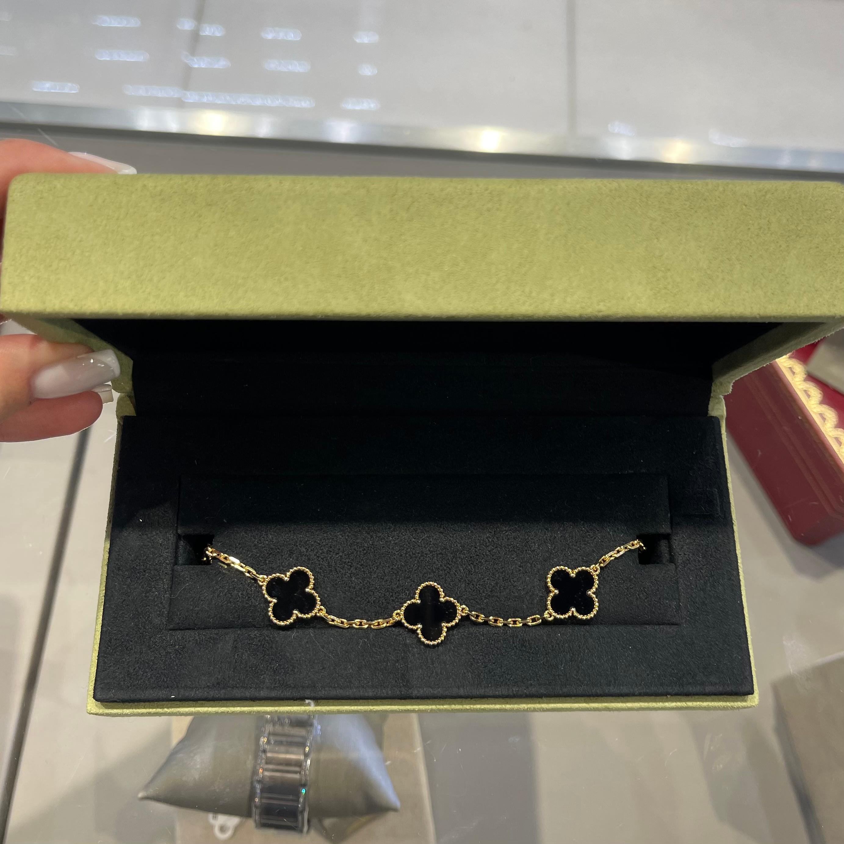 Designer:  Van Cleef & Arpels 
Collection:  Vintage Alhambra
Collection: VCARA41300
Style: Bracelet
​​​​​​​Motifs: 5
Stone: Onyx
Metal Type: Yellow Gold  
Metal Purity: 18K 
Hallmarks: VCA; Serial #
​Includes: 24-Month Brilliance Jewels Warranty
   