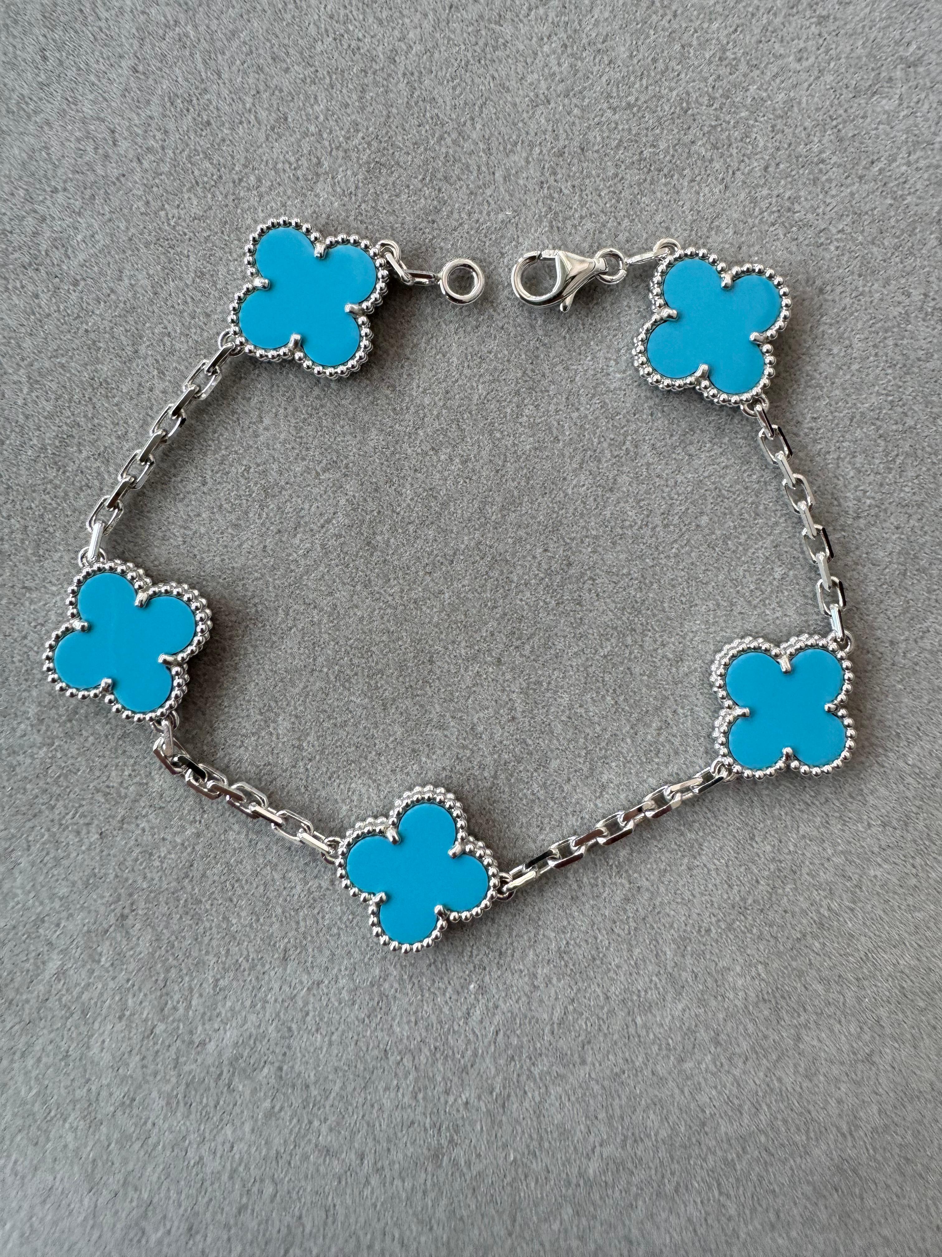 Van Cleef & Arpels Vintage Alhambra Blue Turquoise 18 Karat White Gold Bracelet
18K White Gold AU 750 
Very gorgeous Turquoise with beautiful hues, colors, polish and shine. Please review all photos and video to see how it looks. 
10.74 Total Grams