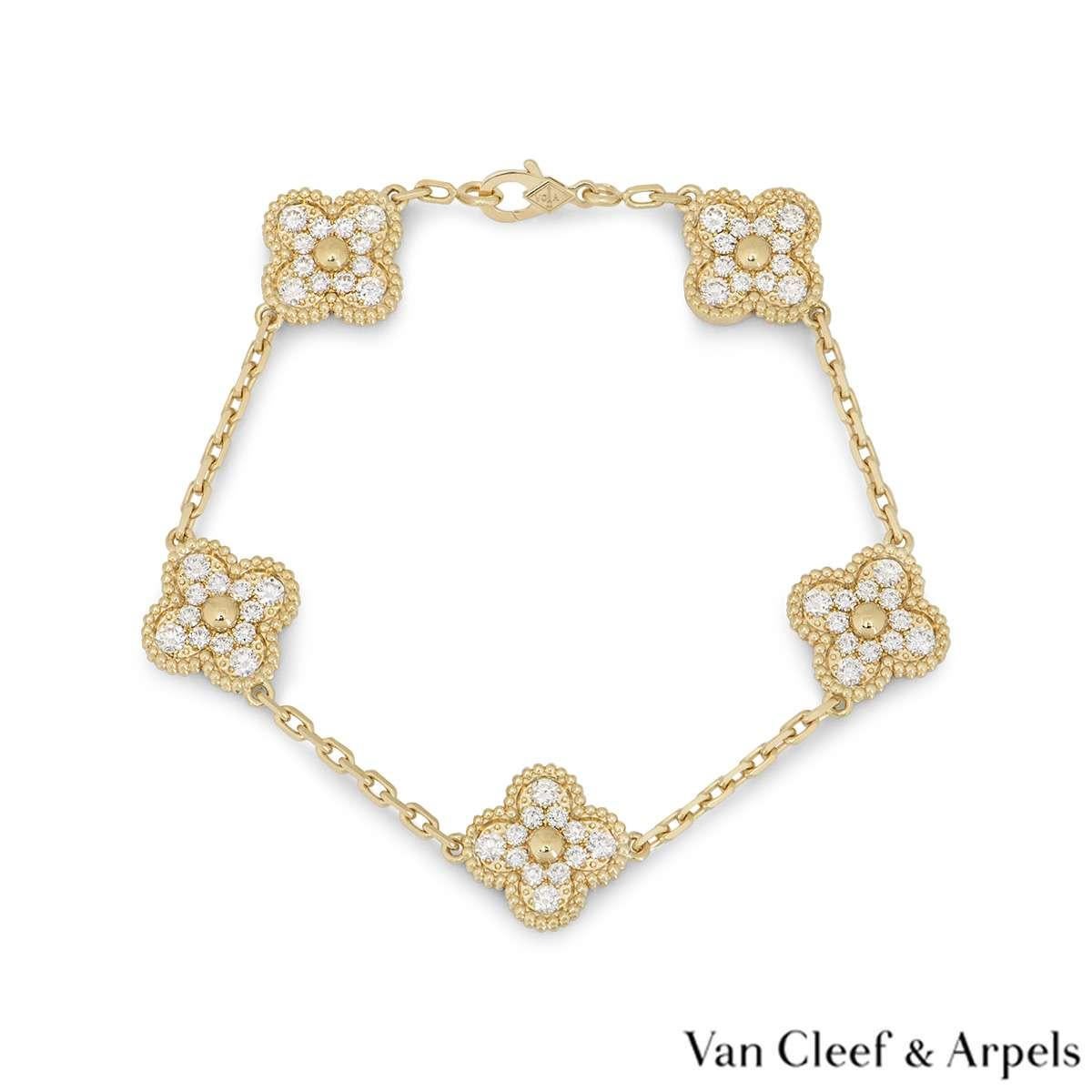 A timeless 18k yellow gold Vintage Alhambra bracelet by Van Cleef & Arpels. The bracelet features 5 pave diamond set clover motifs, complemented by a gold beaded outer edge. There are 60 round brilliant cut diamonds, with a total weight of 2.42ct,