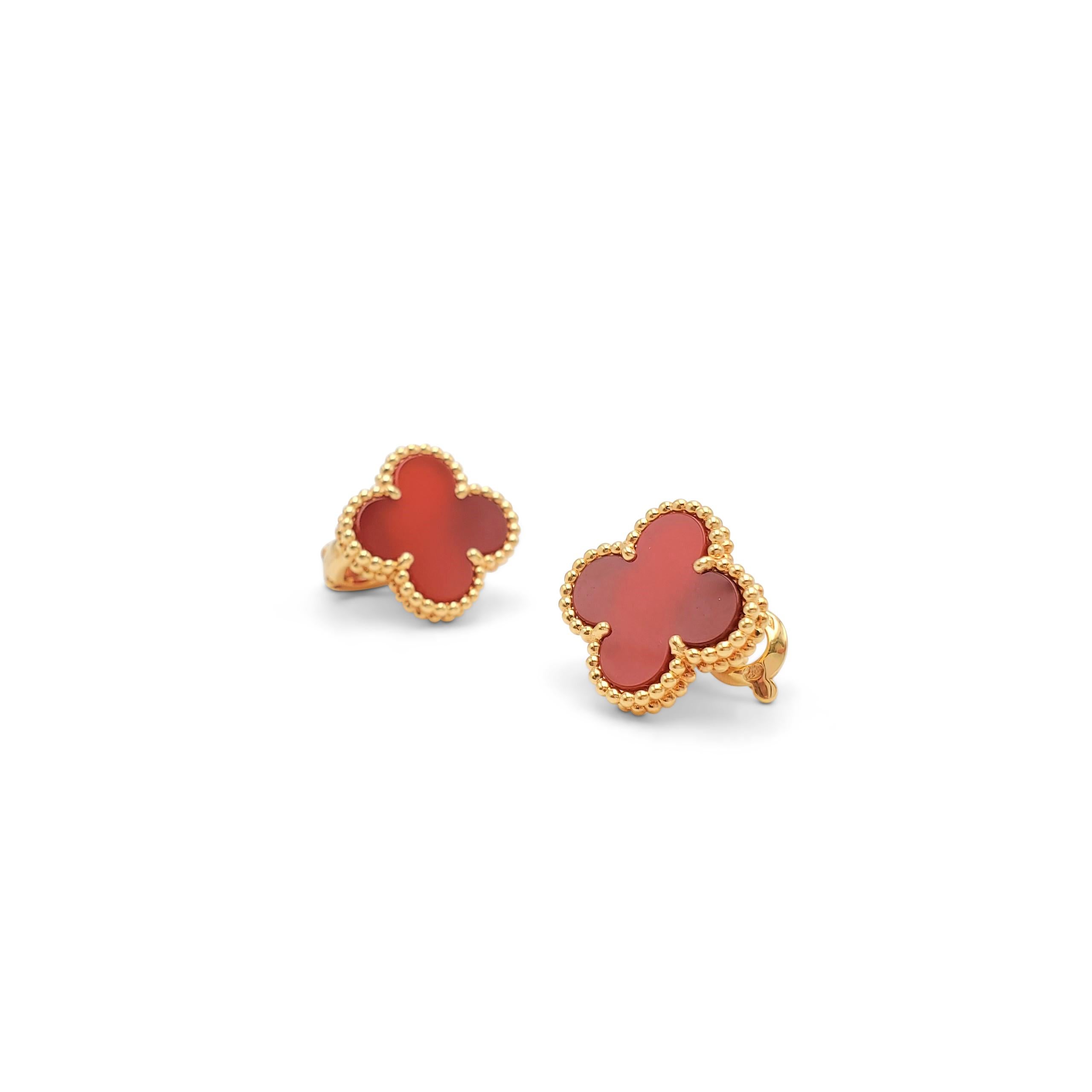 Authentic Van Cleef & Arpels 'Vintage Alhambra' earrings crafted in 18 karat yellow gold featuring the cover leaf-inspired motif in carnelian. Signed VCA, Au750,  with serial number and hallmarks. The earrings are presented with the original box or