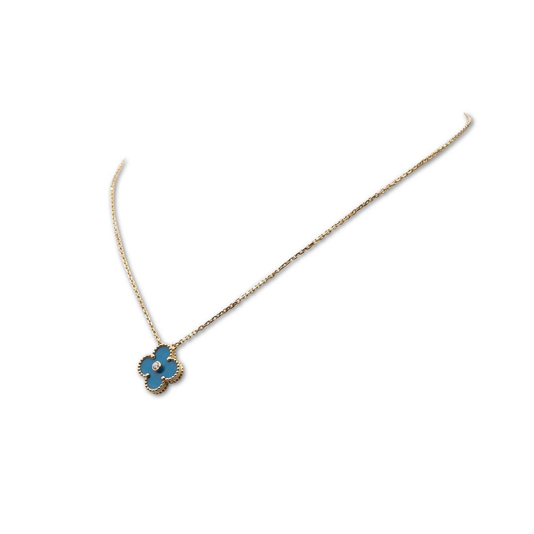 Authentic Van Cleef & Arpels limited edition 'Vintage Alhambra' pendant necklace crafted in 18 karat yellow gold features a single clover-inspired motif set with celestial Blue Sevres porcelain and one round brilliant cut diamond with an estimated