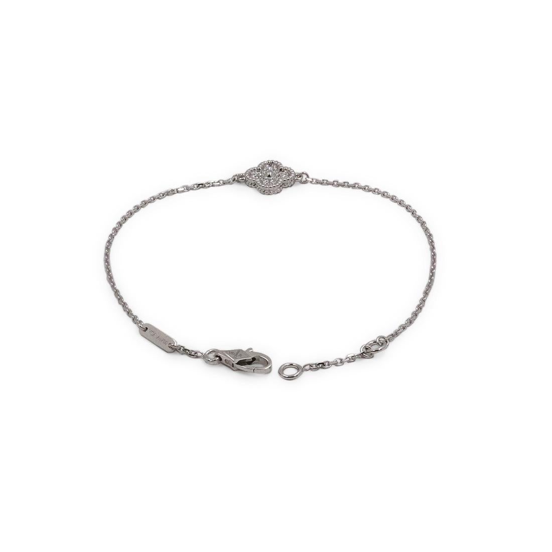 Authentic Van Cleef & Arpels Sweet Alhambra bracelet crafted in 18 karat white gold and set with approximately 0.08 carats of round brilliant cut diamonds. The bracelet will fit up to a 6 3/4 inch wrist. Signed VCA, Au750, with serial number and