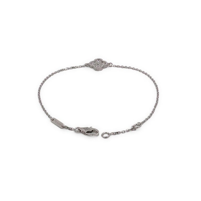 Authentic Van Cleef & Arpels Vintage Alhambra bracelet crafted in 18 karat white gold and set with approximately 0.08 carats of round brilliant cut diamonds. The bracelet will fit up to a 6 3/4 inch wrist. Signed VCA, Au750, with serial number and