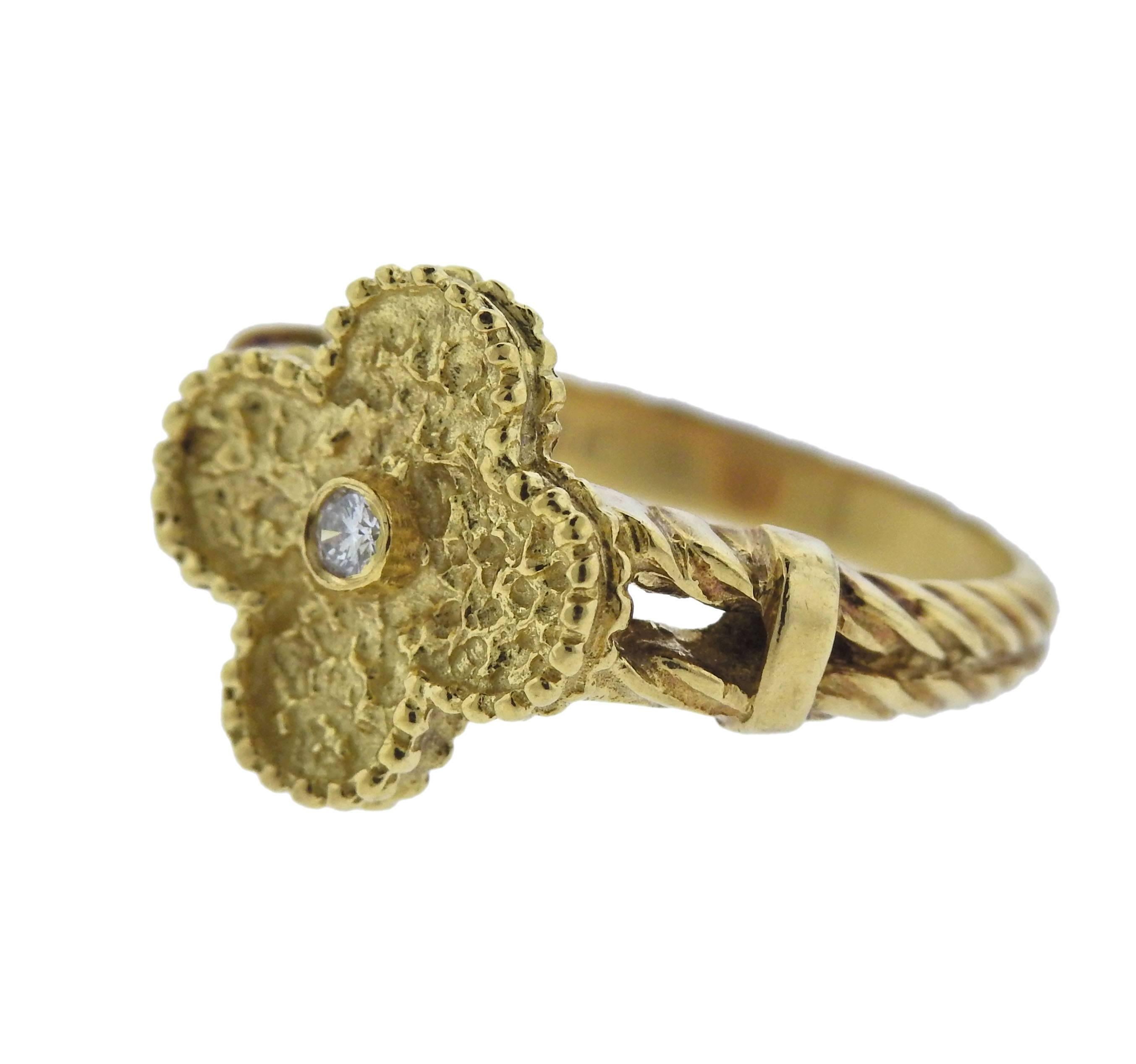  18k yellow gold Vintage Alhambra ring, crafted by Van Cleef & Arpels, set with a 0.06ct VVS/FG diamond in the center.  Ring size - 6.25, ring top - 13mm 13mm, weighs 5 grams. Marked: VCA NY, 18k, GV 605, 21**.