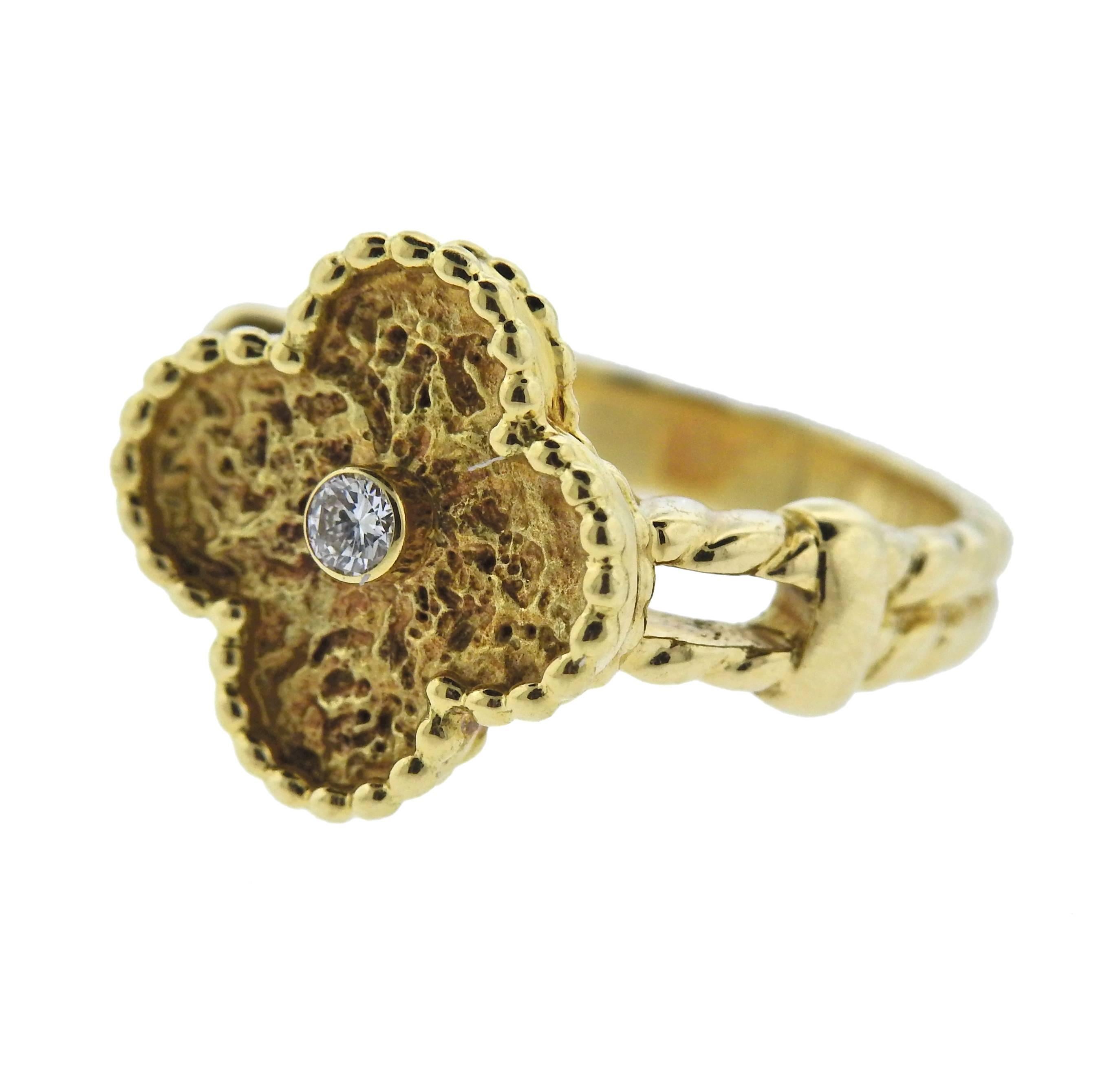 18k gold Van Cleef & Arpels vintage alhambra ring featuring 1 F-G/VVS diamond measuring approximately 0.06ct, Ring size 5.5, motif measures 15mm X 15mm. Weight is 7.5 grams, marked VCA, 750, AL0500YG***.