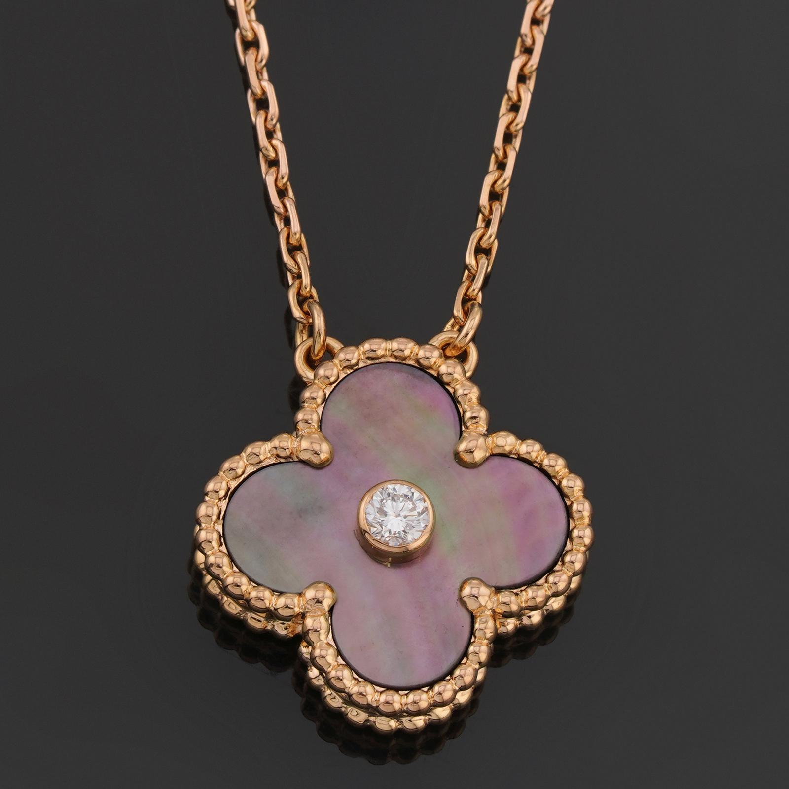 This exquisite limite edition Van Cleef & Arpels necklace from the iconic Vintage Alhambra collection features a gray mother-of-pearl lucky clover pendant crafted in 18k yellow gold and bezel-set with a solitaire brililant-cut diamond. Made in