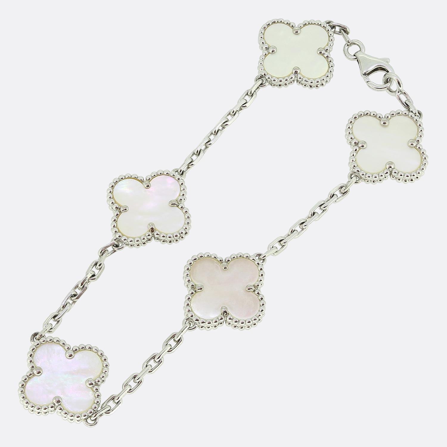Here we have an iconic bracelet from the world renowned luxury jewellery house of Van Cleef & Arpels. This bracelet forms part of the Vintage Alhambra collection and showcases five white gold clover motifs with a beaded edging and mother of pearl