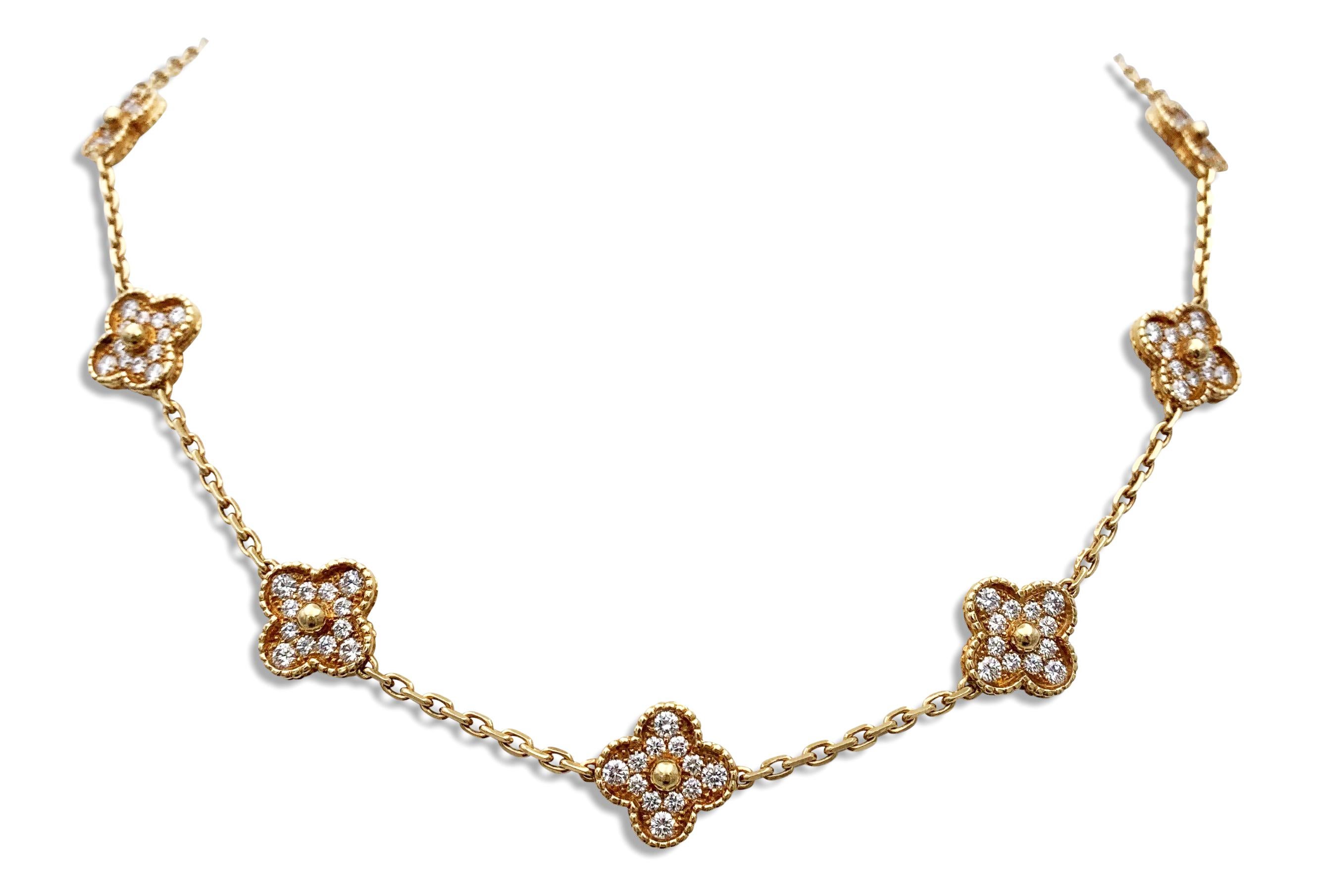 Authentic Van Cleef & Arpels 'Vintage Alhambra' necklace crafted in 18 karat yellow gold featuring 10 cloverleaf inspired motifs set with high-quality round brilliant cut diamonds, weighing an estimated 5.60 cttw.  The necklace measures 17 1/2