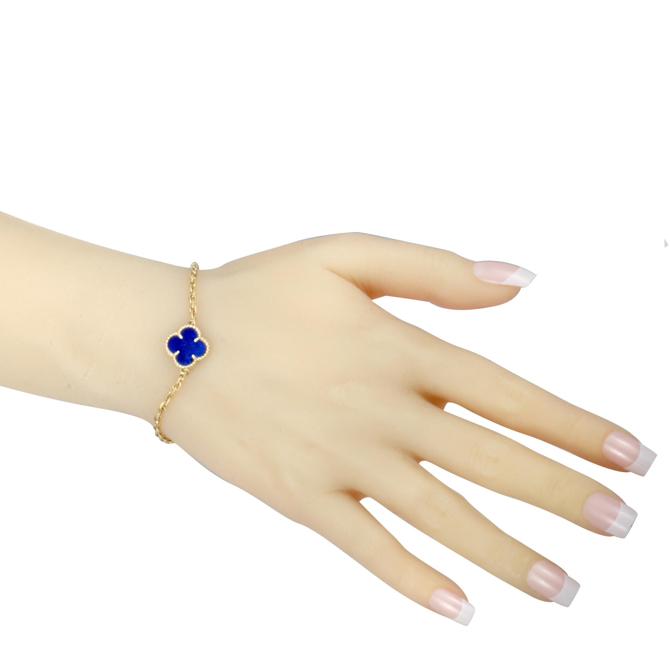 An extremely rare piece from the fascinating “Vintage Alhambra” collection by Van Cleef & Arpels, this wonderful bracelet boasts an exceptionally elegant design that is accentuated by an enticing lapis lazuli. The bracelet is made of attractive 18K