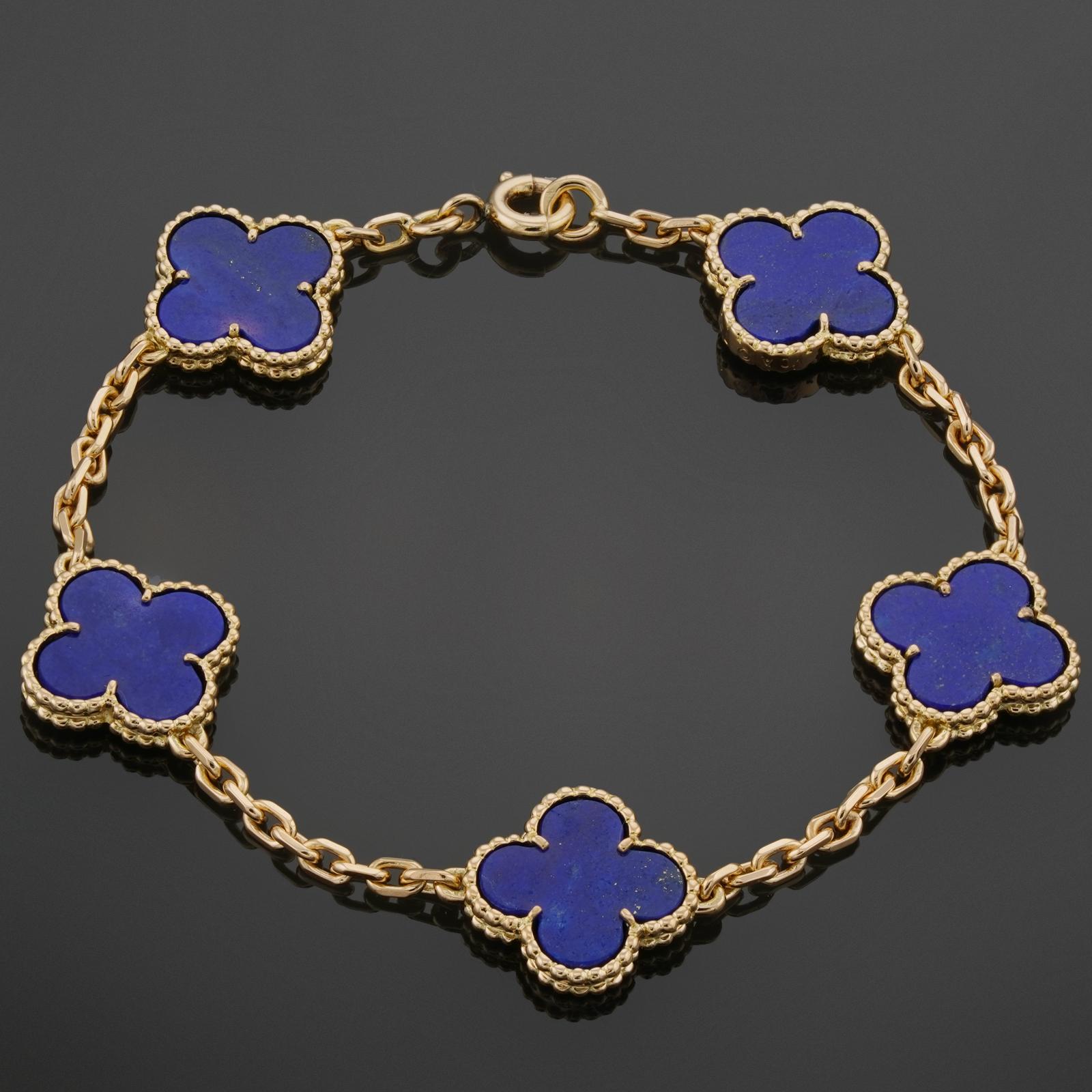 This rare Van Cleef & Arpels bracelet from the classic Vintage Alhambra collection is crafted in 18k yellow gold and features 5 lucky clover motifs inlaid with blue lapiz lazuli in round bead settings. Made in France circa 1980s. Measurements: 0.59