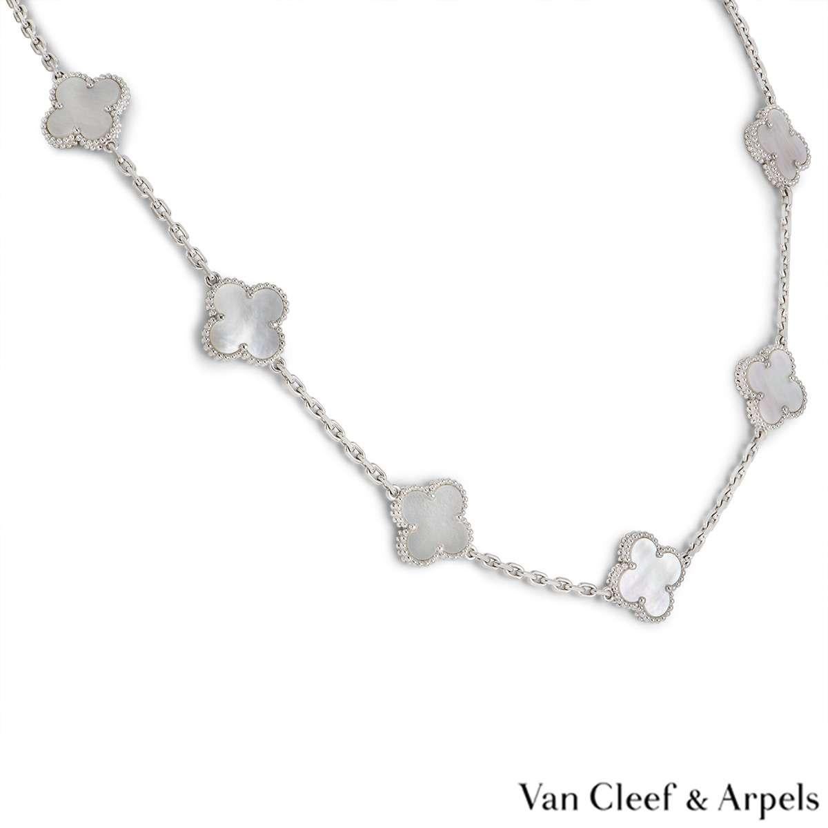 An 18k white gold Vintage Alhambra necklace by Van Cleef & Arpels. The necklace has 10 motifs, each set with a mother of pearl inlay and complemented by a beaded outer edge. The necklace measures 17 inches in length, features a lobster clasp and has