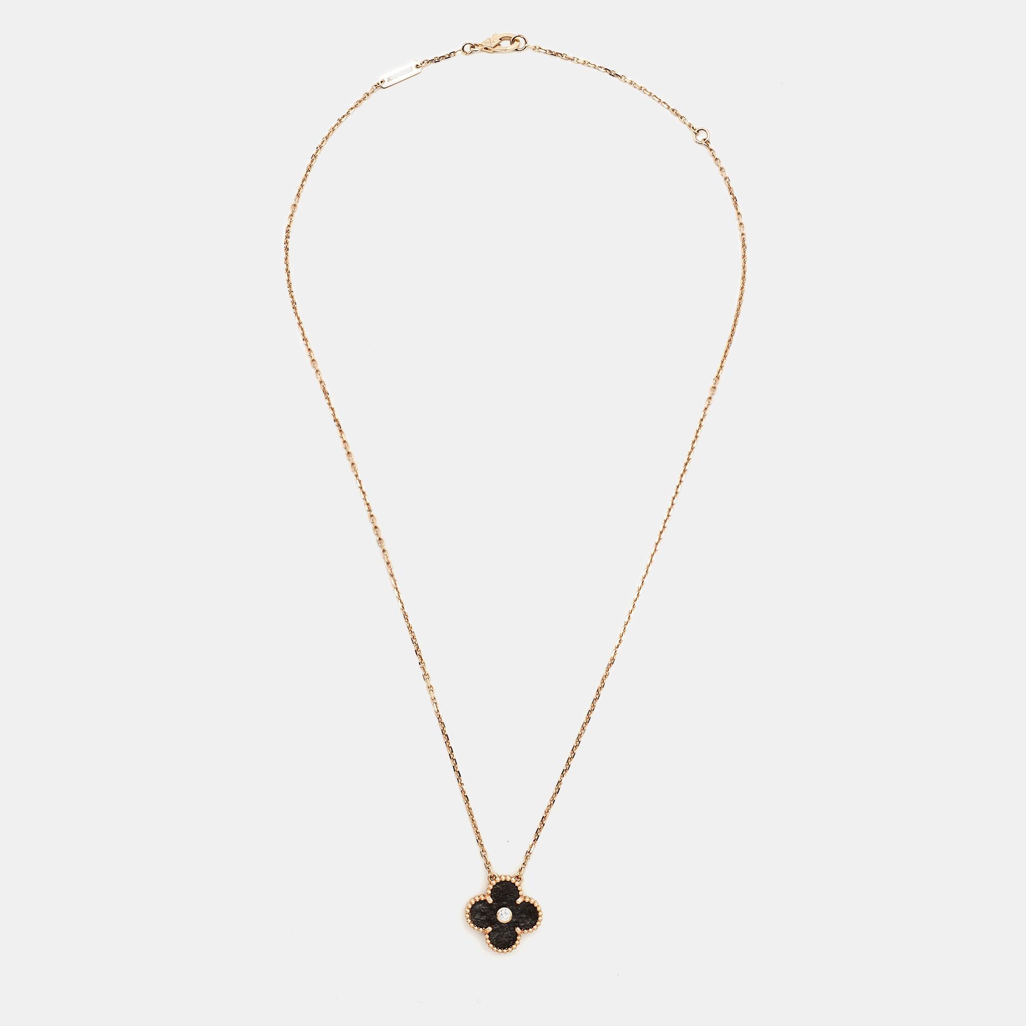 Invest in this opulent Van Cleef and Arpels 2021 Holiday pendant necklace from their iconic Vintage Alhambra collection. The 18k rose gold Alhambra pendant is set with a single diamond stud and held by a chain. A sweet mix of minimalist style and