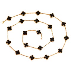 Van Cleef & Arpels, collier long vintage Alhambra en or jaune à motifs en onyx 20