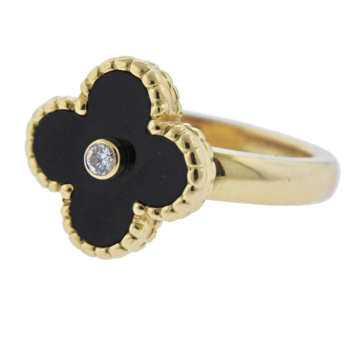 18k yellow gold Vintage Alhambra ring, crafted by Van Cleef & Arpels, set with onyx top and 0.06ct VVS/FG diamond in the center. Retail $3150, comes with COA. Ring size - 5.75, ring top measures 15mm x 15mm and weighs 8.1 grams. 