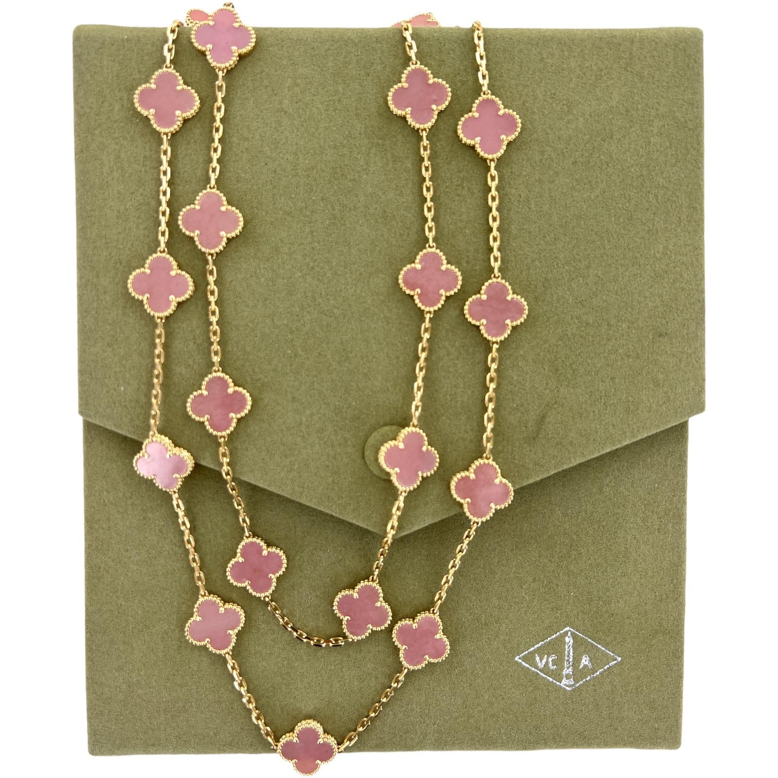 Van Cleef & Arpels Vintage Alhambra Pink Opal 20 Motif Necklace fashioned in 18 karat yellow gold. The necklace features 20 opal stations, and measures 34 inches in length. The necklace, circa 2015, is a rare and retired piece from the collection.