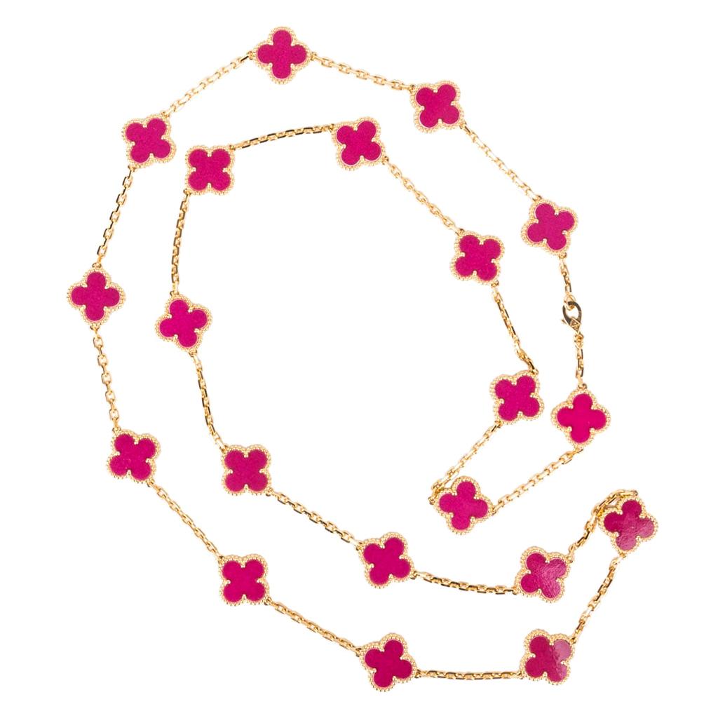 Guaranteed authentic highly collectible Van Cleef & Arpels uber rare Vintage Alhambra  Dark Pink Porcelain De Sevres 20 Motif necklace.
Absolutely fabulous and extremely rare!
Set in 18 Yellow Gold. 
Necklace can be worn as a single strand or