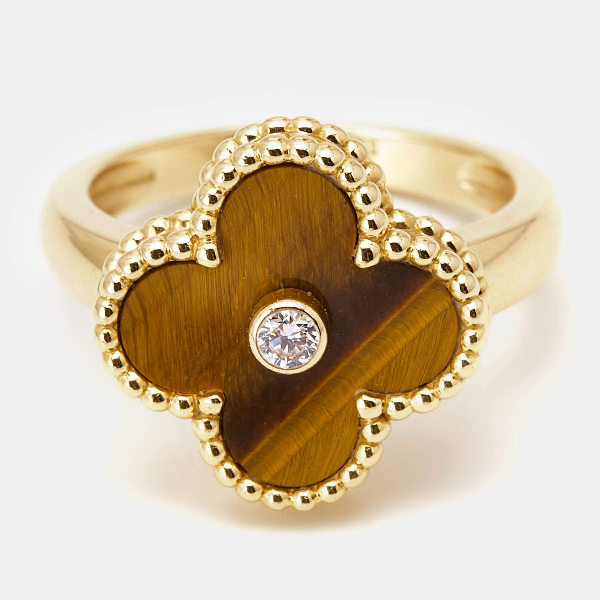 Crafted by Van Cleef & Arpels, the Vintage Alhambra ring exudes timeless charm. A mesmerizing Tiger's Eye gemstone sits gracefully amidst delicate 18k gold beading, accented by a radiant diamond. With an air of refinement, this ring is a testament