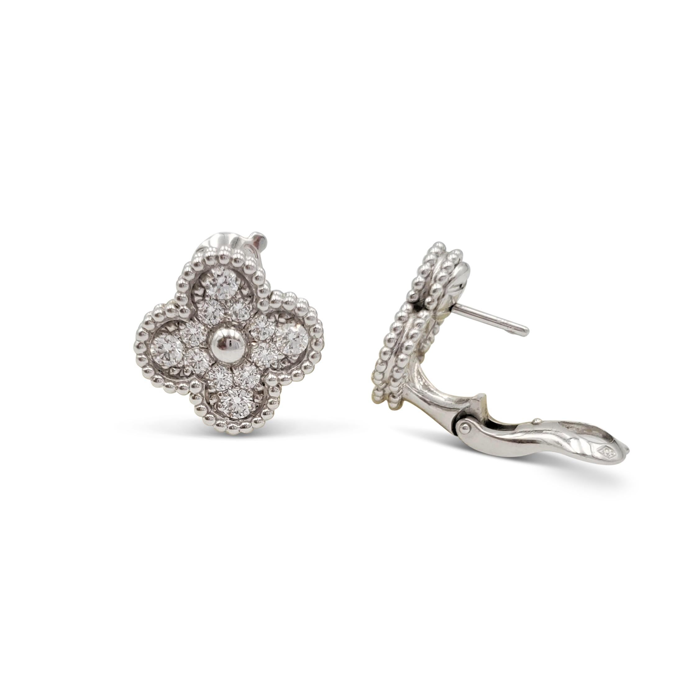Authentic Van Cleef & Arpels Vintage Alhambra earrings inspired by the clover and crafted in 18 karat white gold set with an estimated 0.88 carats of round brilliant cut diamonds (E-F, VS). Signed VCA, Au750, with serial number. The earrings measure