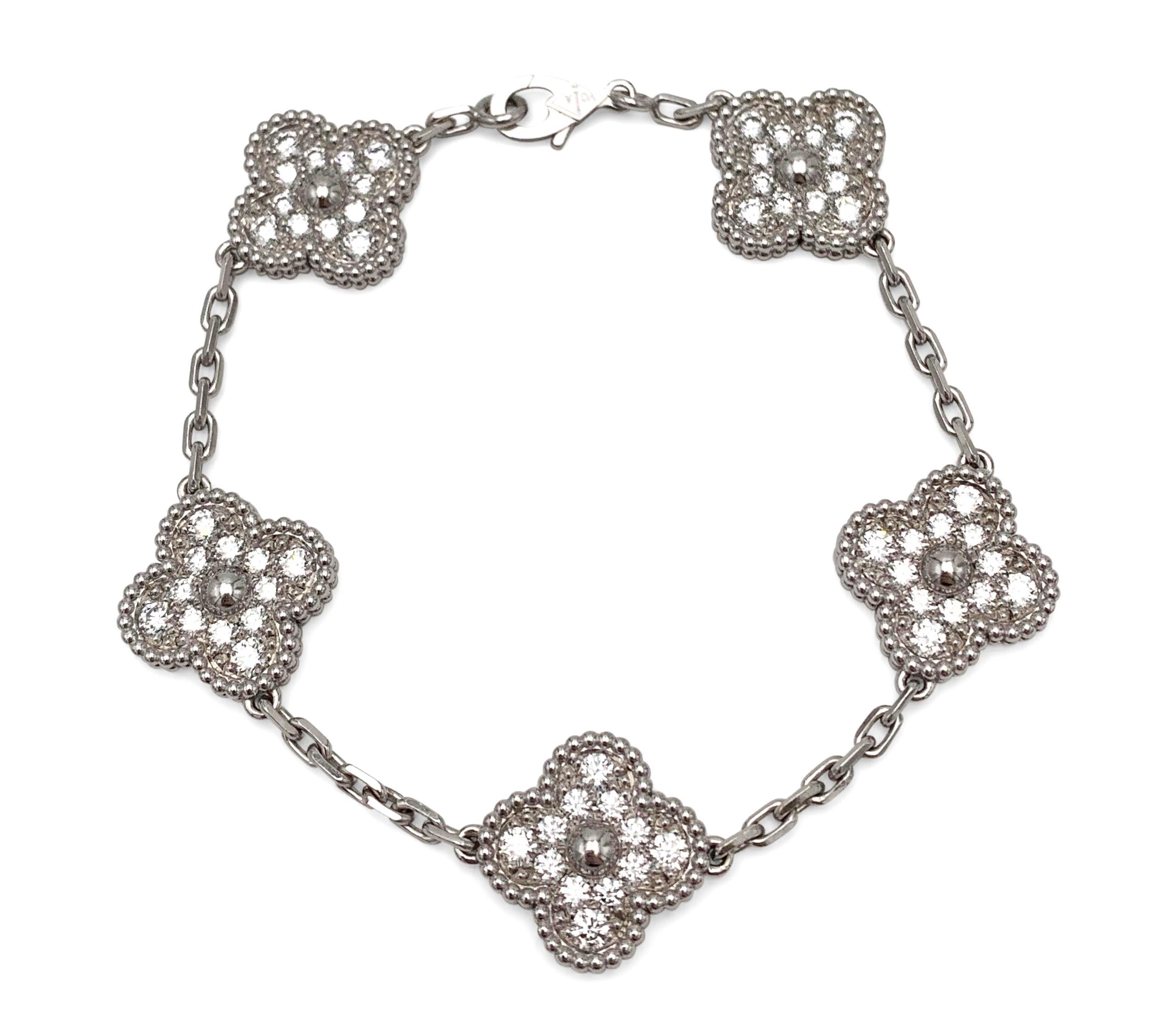 Authentic Van Cleef & Arpels Vintage Alhambra bracelet crafted in 18 karat white gold and set with approximately 60 diamonds, weighing an estimated 1.80 cttw.  The bracelet measures  6.5 inches in length.  Signed VCA, Au750, with serial number and