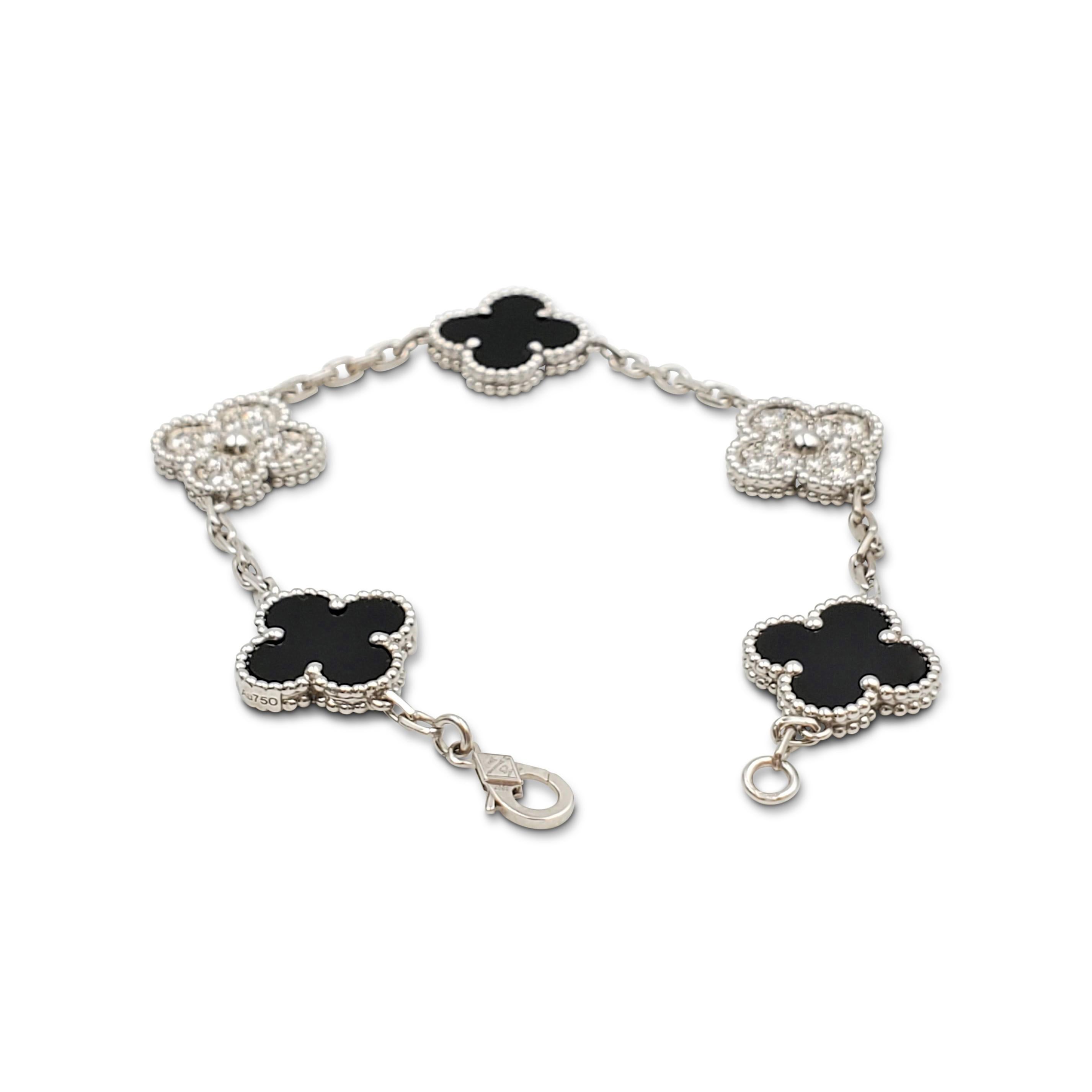 Authentic Van Cleef & Arpels 'Vintage Alhambra' bracelet crafted in 18 karat white gold features alternating clover motifs of onyx and pave diamonds (E-F color, VS clarity) weighing an estimated 0.72 carats total weight. The bracelet measures 6 1/2