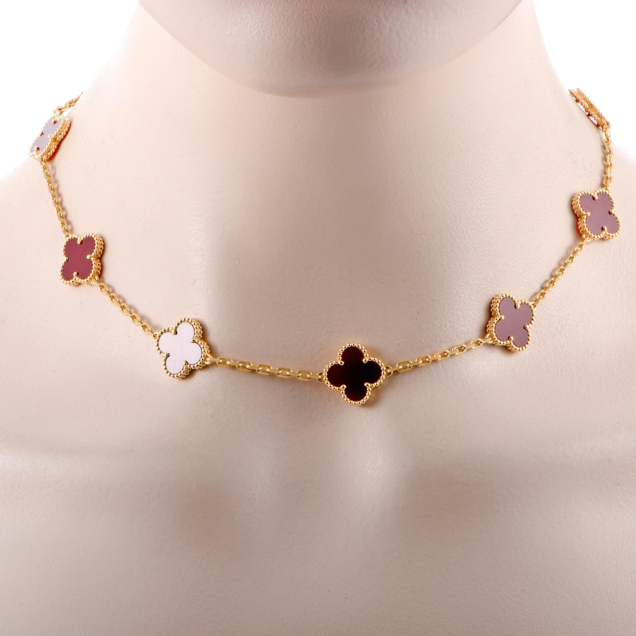 The Van Cleef & Arpels “Vintage Alhambra” necklace is crafted from 18K yellow gold and decorated with carnelians. The necklace weighs 22.2 grams and measures 16” in length.