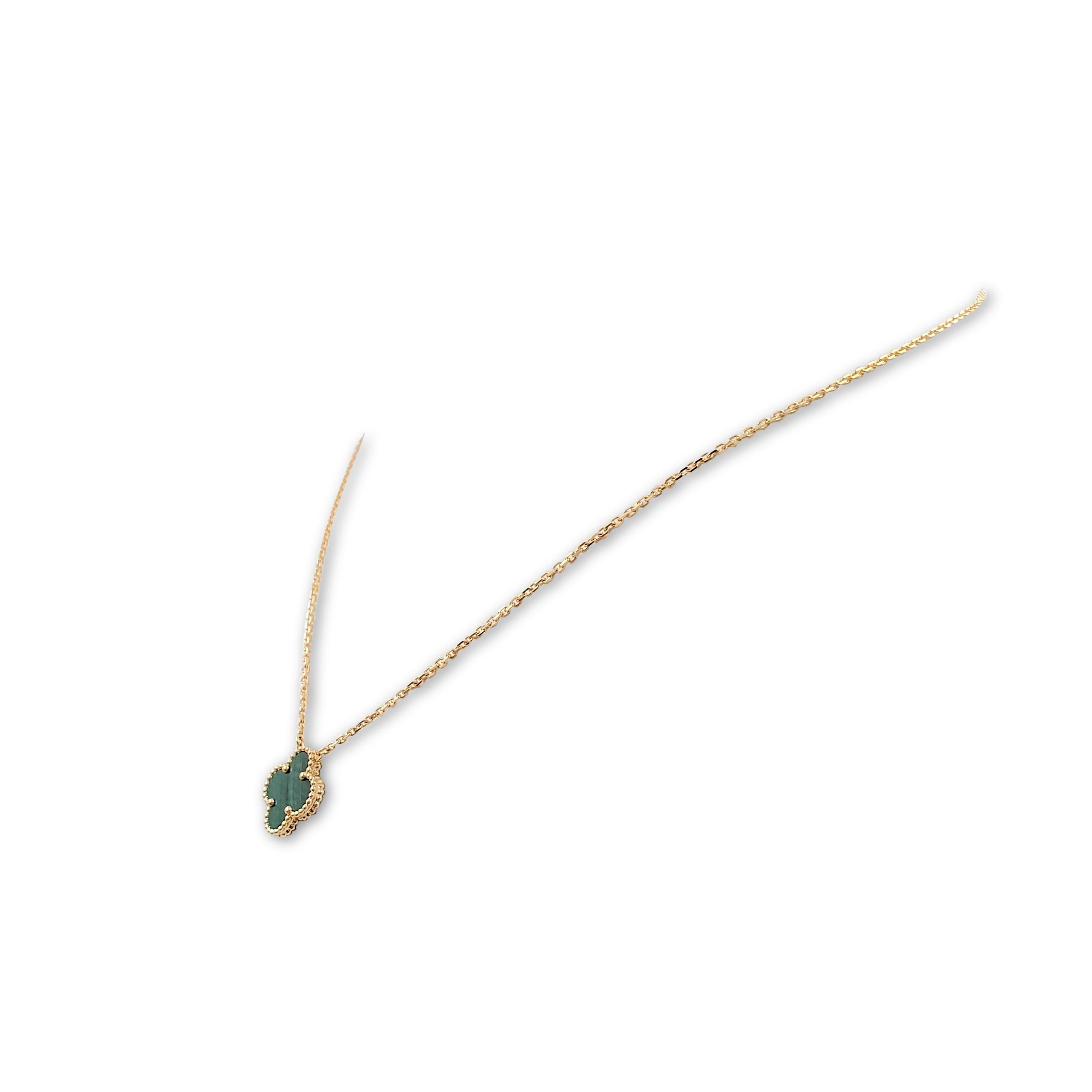 Authentic Van Cleef & Arpels 'Vintage Alhambra' pendant necklace crafted in 18 karat yellow gold features a single malachite clover-inspired motif. Signed VCA, Au750, with serial number. The adjustable chain measures 16 1/2 inches in length. The