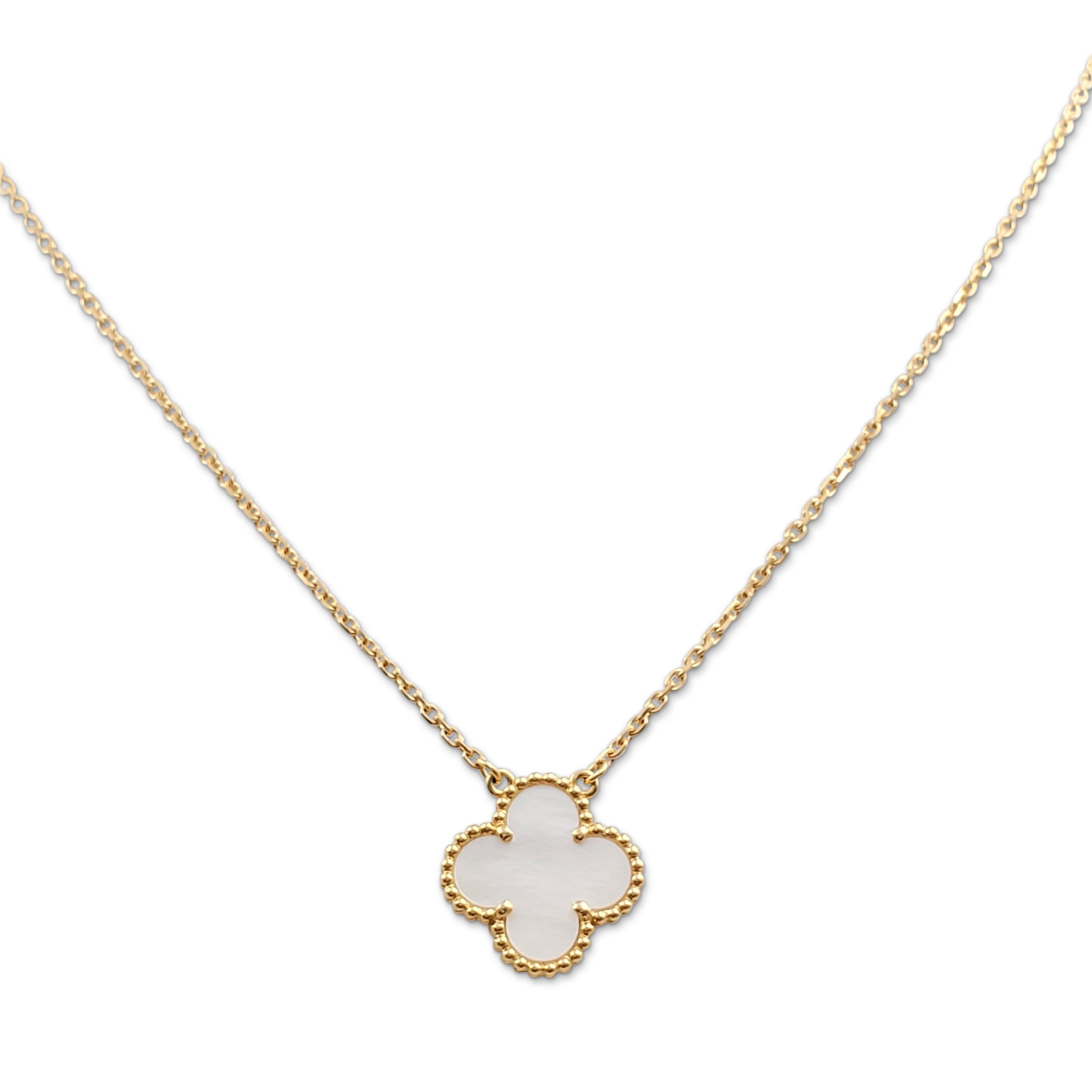 Authentic Van Cleef & Arpels 'Vintage Alhambra' pendant necklace crafted in 18 karat yellow gold features a single mother-of-pearl clover-inspired motif. Signed VCA, Au750, with serial number. The adjustable chain measures 16 1/2 inches in length.