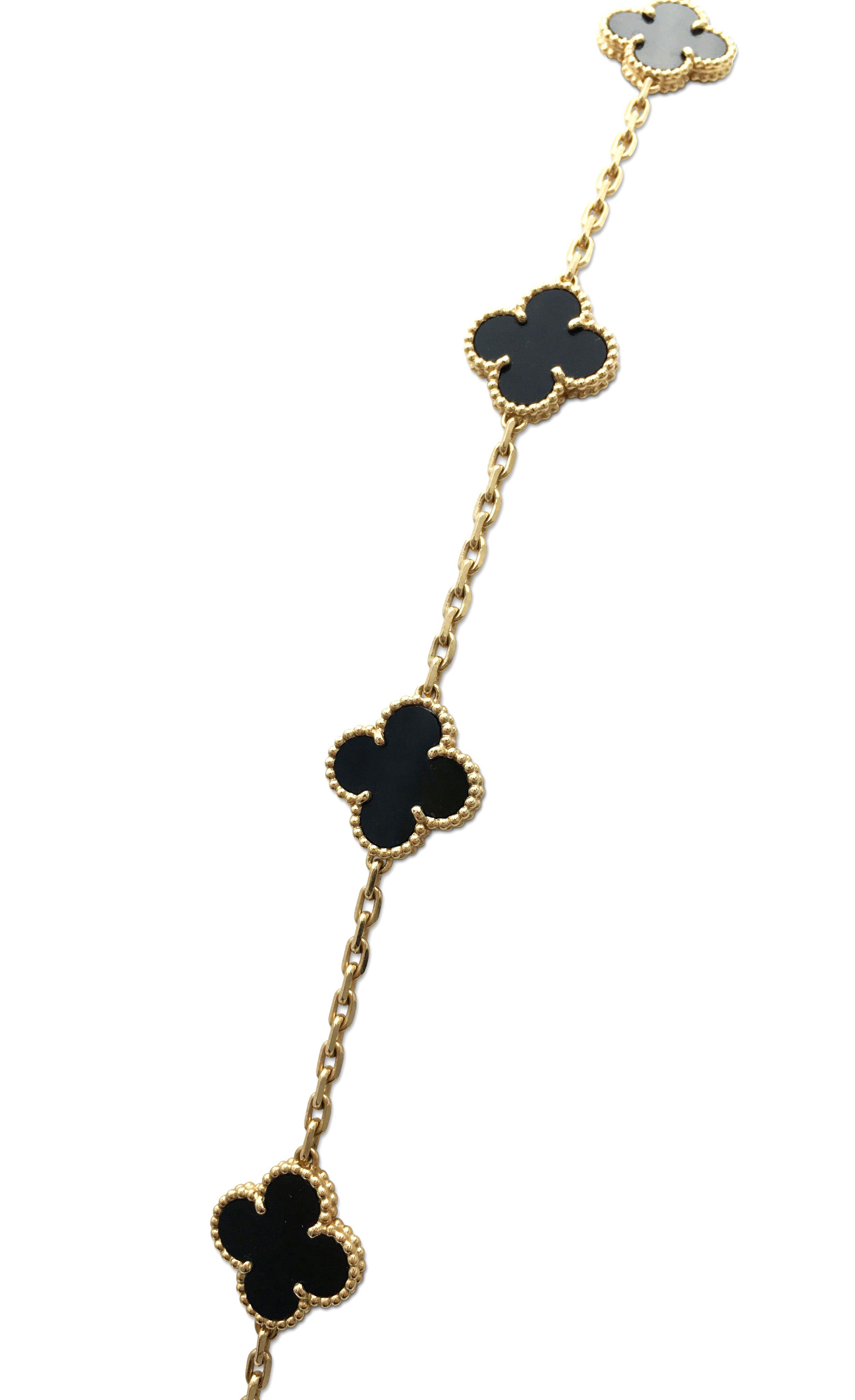 Authentic Van Cleef & Arpels 'Vintage Alhambra' necklace crafted in 18 karat yellow gold featuring 20 clover leaf inspired motifs of onyx stones. Signed VCA, Au750, with serial number and hallmarks. The necklace is presented with the original box,
