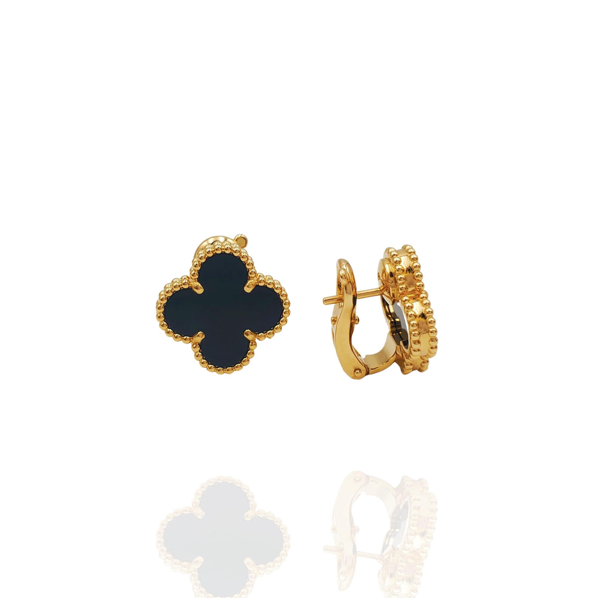 Authentic Van Cleef & Arpels 'Vintage Alhambra' earrings crafted in 18 karat yellow gold featuring the cover leaf-inspired motif in onyx. Signed VCA, Au750, with serial number and hallmarks. The earrings are presented with the original box and