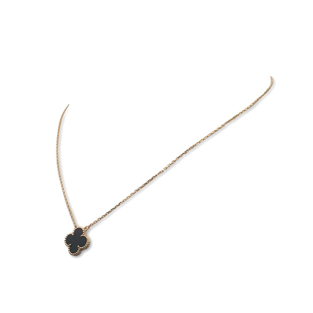 Authentic Van Cleef & Arpels 'Vintage Alhambra' pendant necklace crafted in 18 karat yellow gold features a single Onyx clover-inspired motif. The adjustable chain measures 16 1/2 inches in length. Signed VCA, Au750, with serial number. The necklace