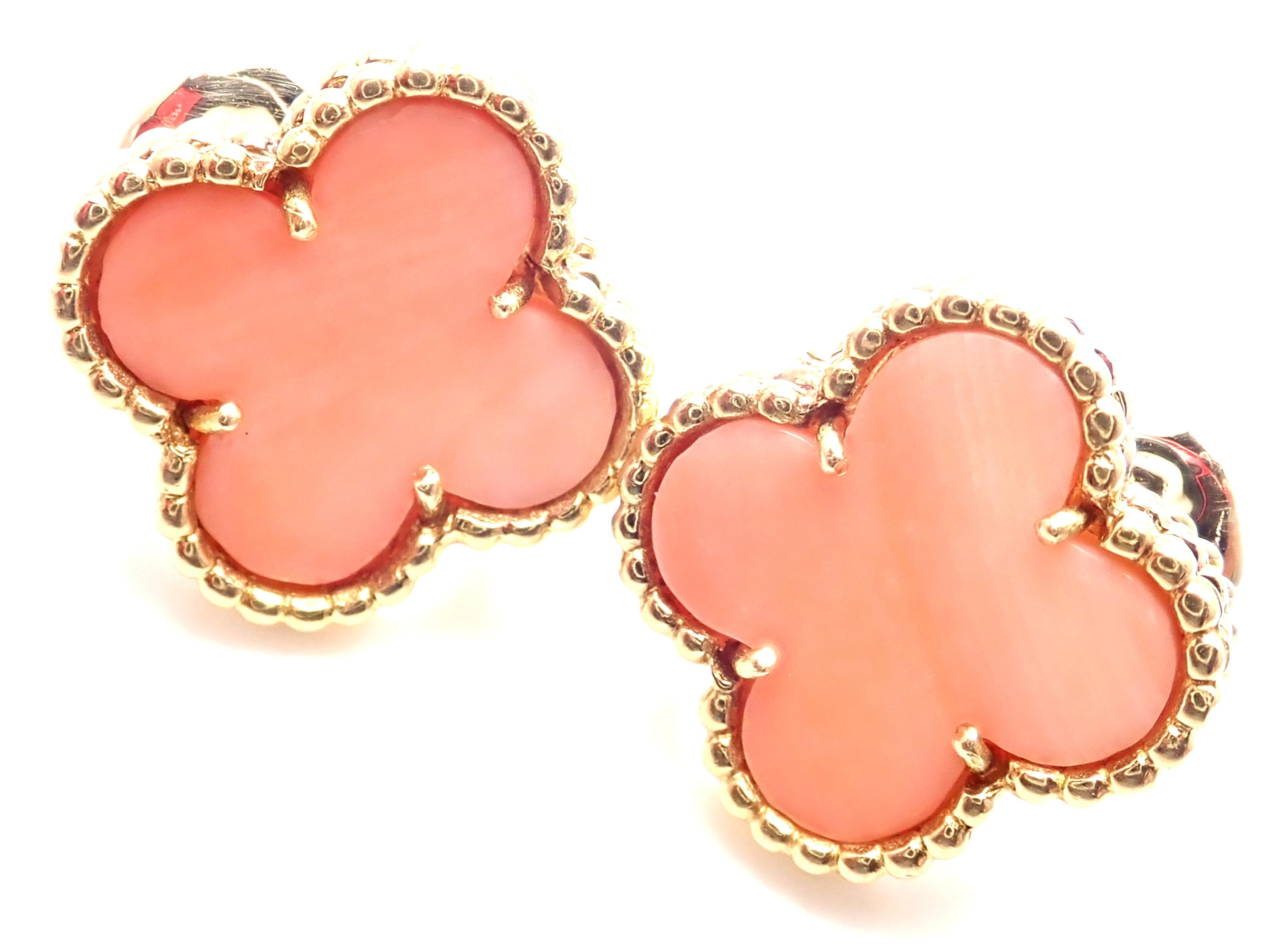 18k Yellow Gold Vintage Alhambra Angel Skin Coral Earrings by Van Cleef & Arpels.  
With 2 alhambra shape angel skin coral stones: 15mm each. 
These earrings are pierced ears.  
These earrings come with service paper from Van Cleef & Arpels store in