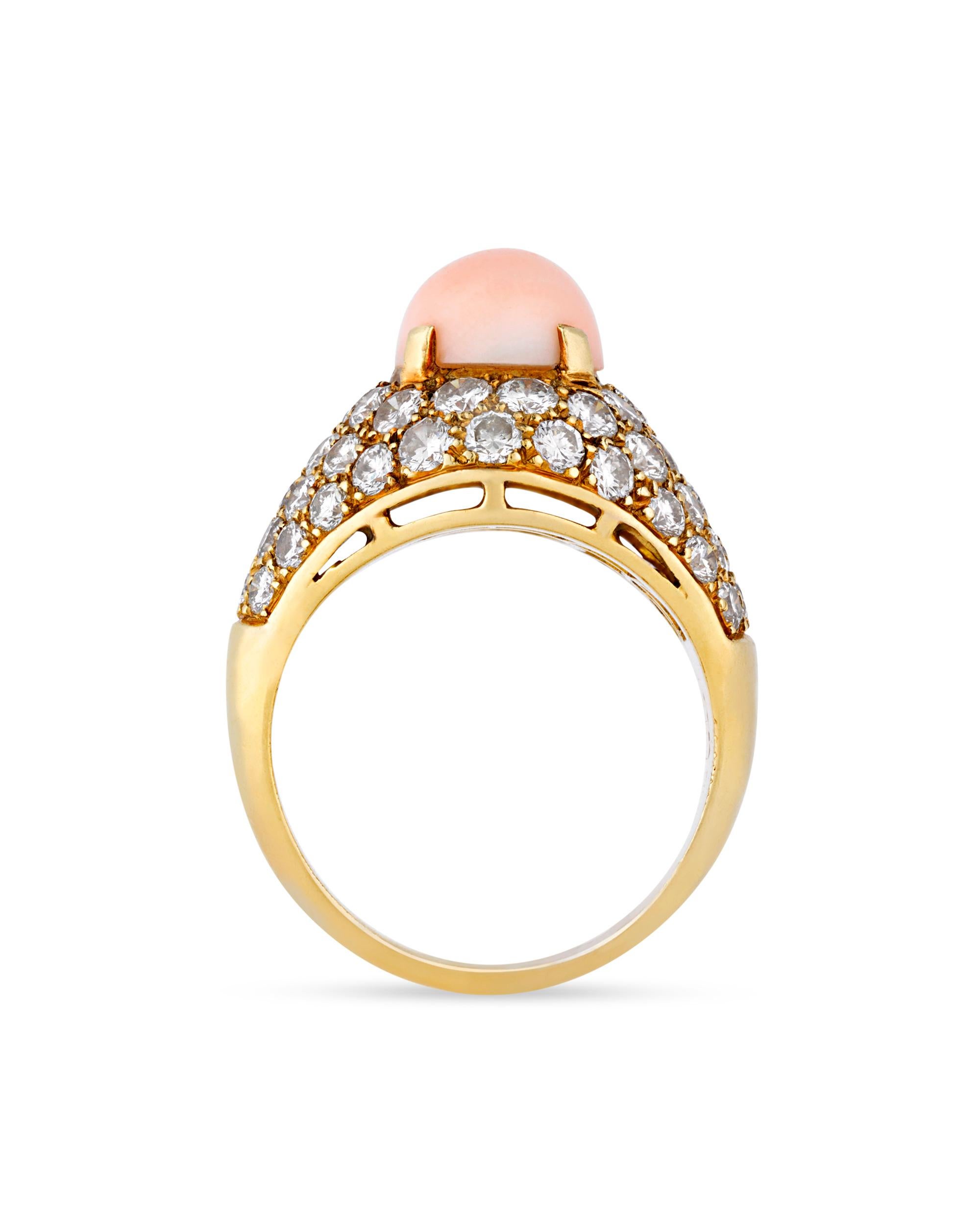 This vintage coral and diamond ring by the French jewelry maison Van Cleef & Arpels makes a classic statement. The exceptional coral cabochon at its center exhibits a delicate “angel skin” hue, the pale pink color that is most desired in coral