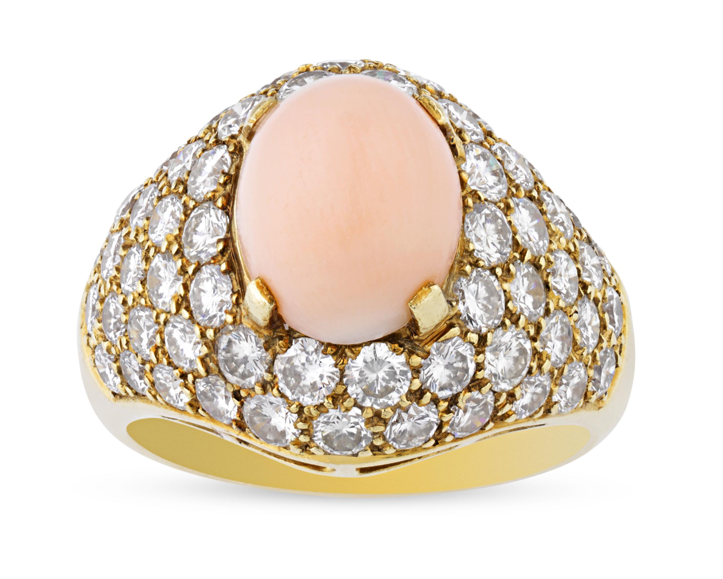 This vintage coral and diamond ring by the French jewelry maison Van Cleef & Arpels makes a classic statement. The exceptional coral cabochon at its center exhibits a delicate “angel skin” hue, the pale pink color that is most desired in coral