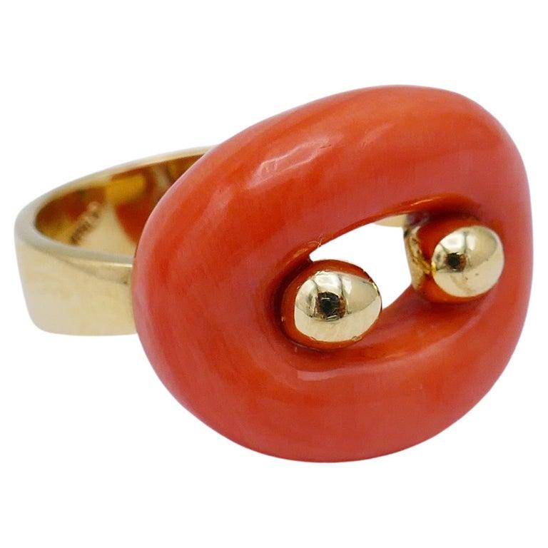 A cute vintage ring by Van Cleef & Arpels. Made of coral and 18k yellow gold. 
Stamped with VCA maker’s mark, a hallmark for 18k gold and a country of origin (Italy). Comes with a proof of purchase from the VCA store in Japan (see