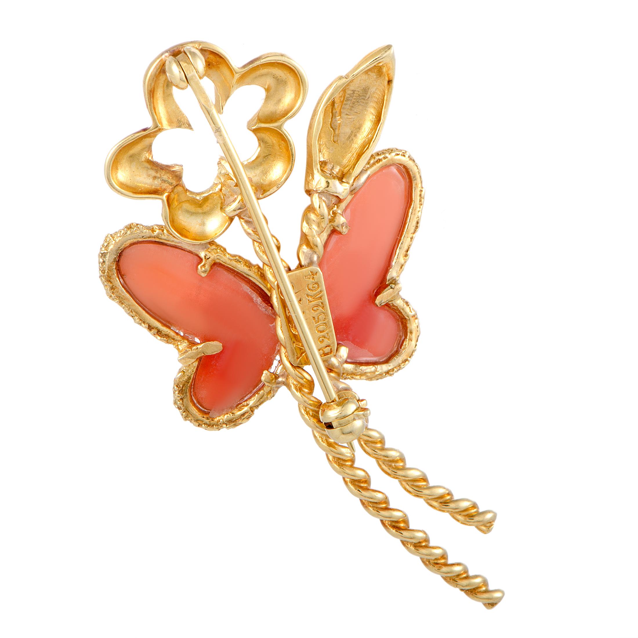 This vintage Van Cleef & Arpels brooch is made out of 18K yellow gold, diamond and coral. The brooch weighs 7.1 grams and measures 2.00” in length and 1.00” in width.

Offered in estate condition, this jewelry piece includes the manufacturer’s box.