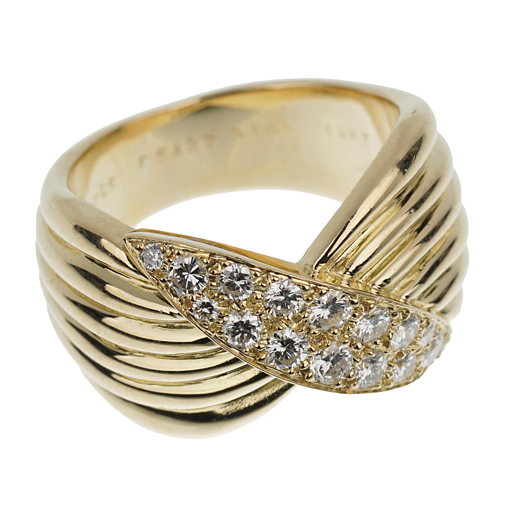 Imagine a stunning creation from the esteemed Van Cleef & Arpels, a Vintage Diamond Yellow Gold Cocktail Ring that exudes sophistication and timeless elegance. This masterpiece features an 18k yellow gold band, meticulously crafted to embody both