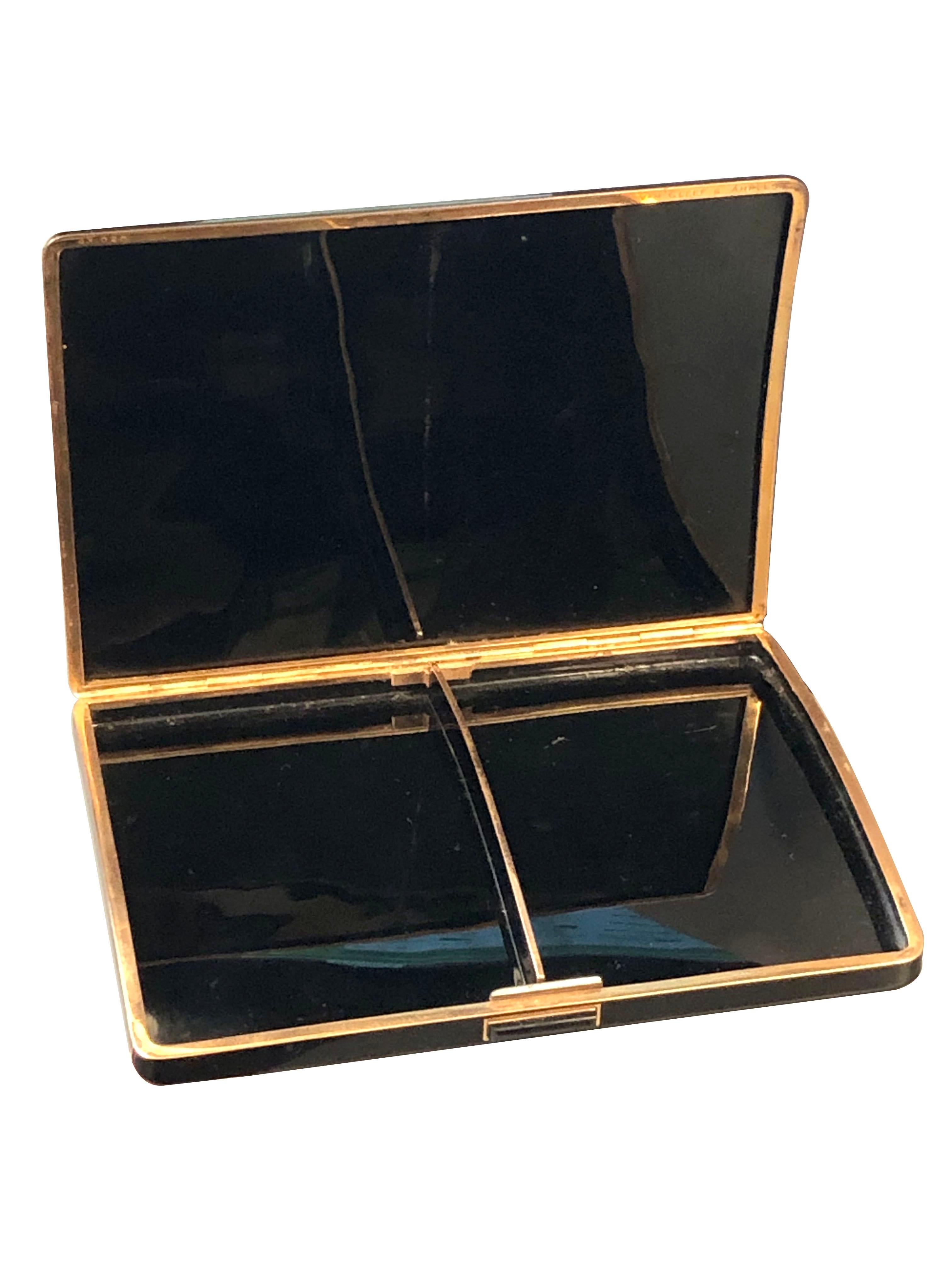 Circa 1950s Van Cleef & Arpels Cigarette Case, measuring 5 1/2 X 4 inches and 1/2 inch deep, Gold Gilt metal and Black enamel with an onyx push piece, signed, numbered and and comes in the original suede pouch.