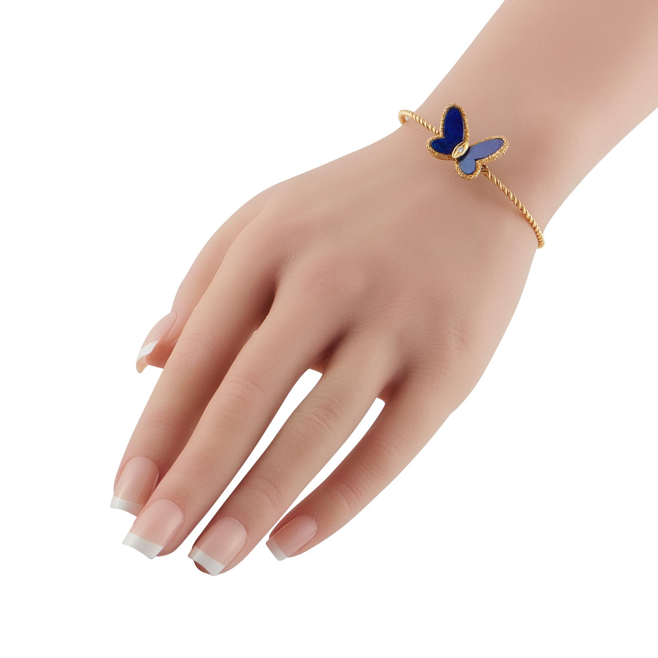 The essence of chic sophistication. This vintage Van Cleef & Arpels bracelet channels the free-spirited Flying Beauties aesthetic of the 1970s. It features a slim rope bracelet crafted in 18K yellow gold. Poised elegantly atop is a butterfly,