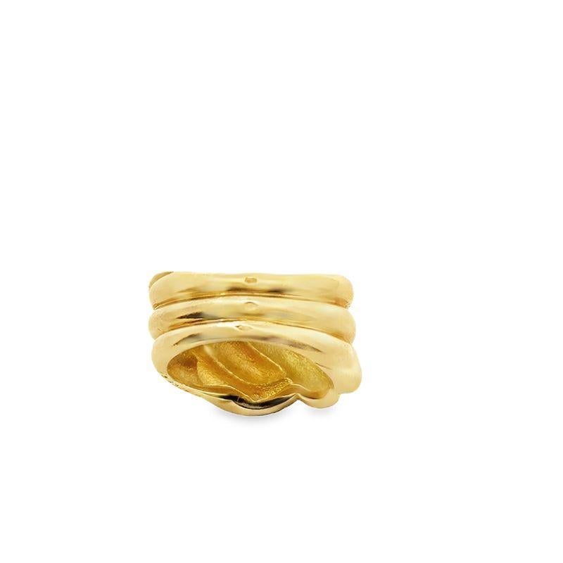 This vintage Van Cleef & Arpels bold knot ring is crafted in 18k yellow gold, showcasing the brand's timeless elegance and distinctive design. Numbered and signed. Weight 13.44 grams. Size 5-1/2.