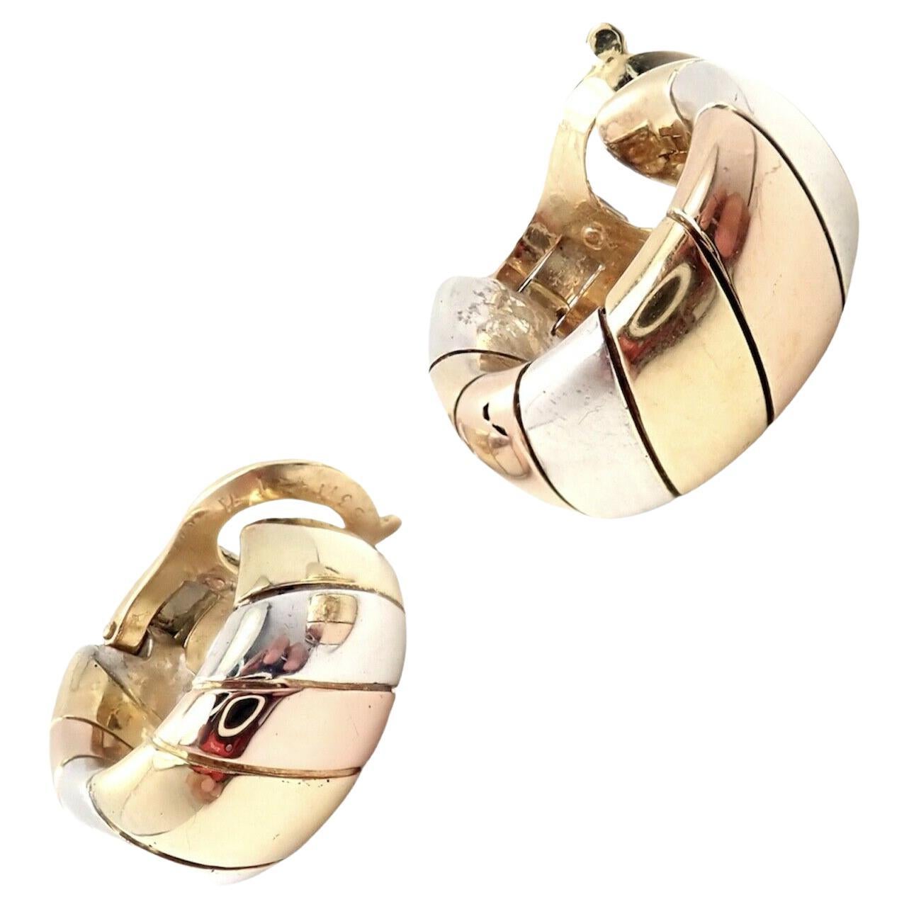 18k Multicolor Gold And White Sterling Silver Hoop Earrings by Van Cleef & Arpels. Circa 1978.
Details:
Weight: 20.8 grams
Measurements: 8mm x 18.5mm
Stamped Hallmarks: 
925 (French Assay Mark) - VCA (c) 78 <- From 1978 - C (serial omitted) -