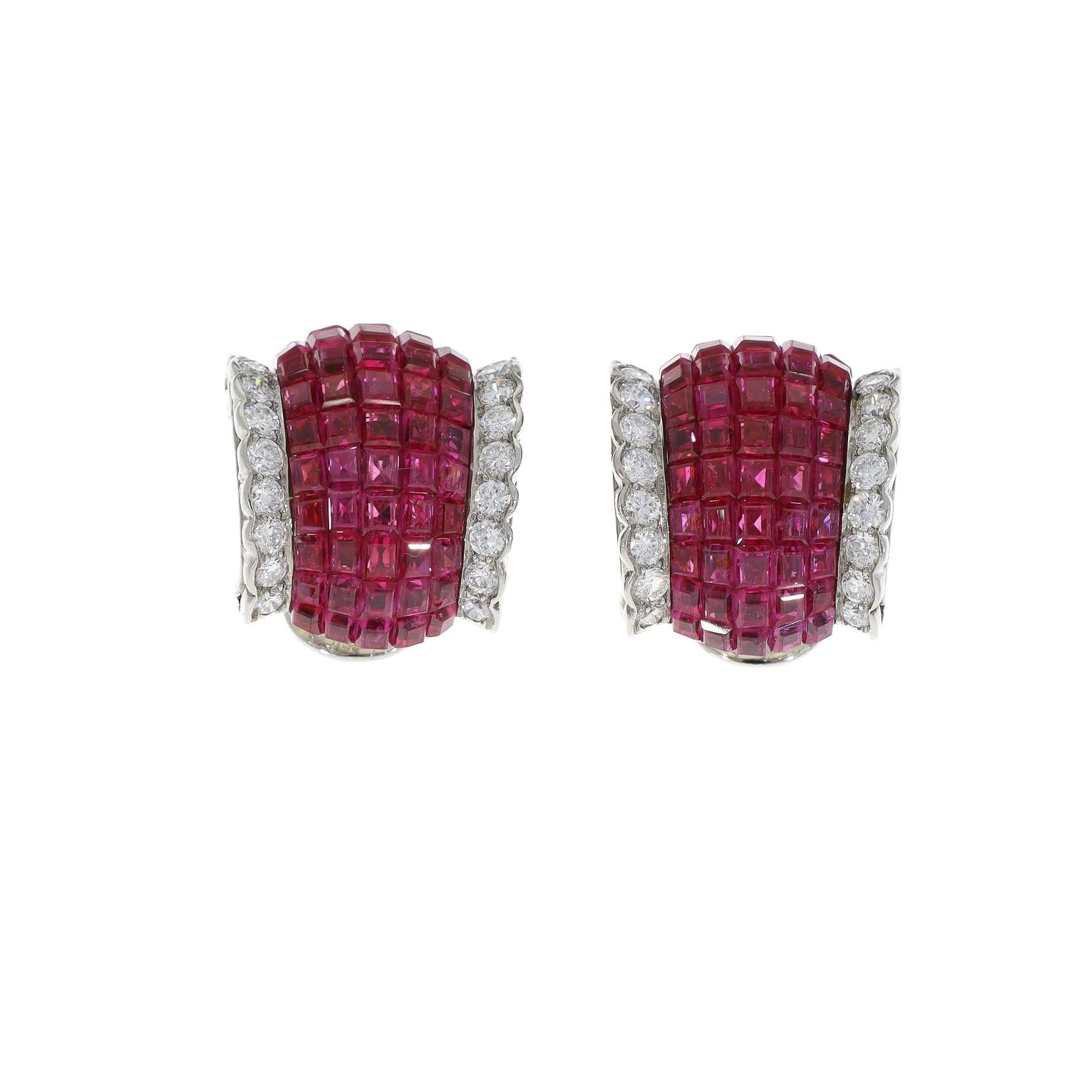 Excellent and rare Van Cleef & Arpels invisibly set vivid ruby diamond 'Boule' ear clips. From Our Signed Jewels Vintage Collection.
The bombe ruby curve edged with diamonds earclips is regarded as one of Van Cleef & Arpels most elegant designs